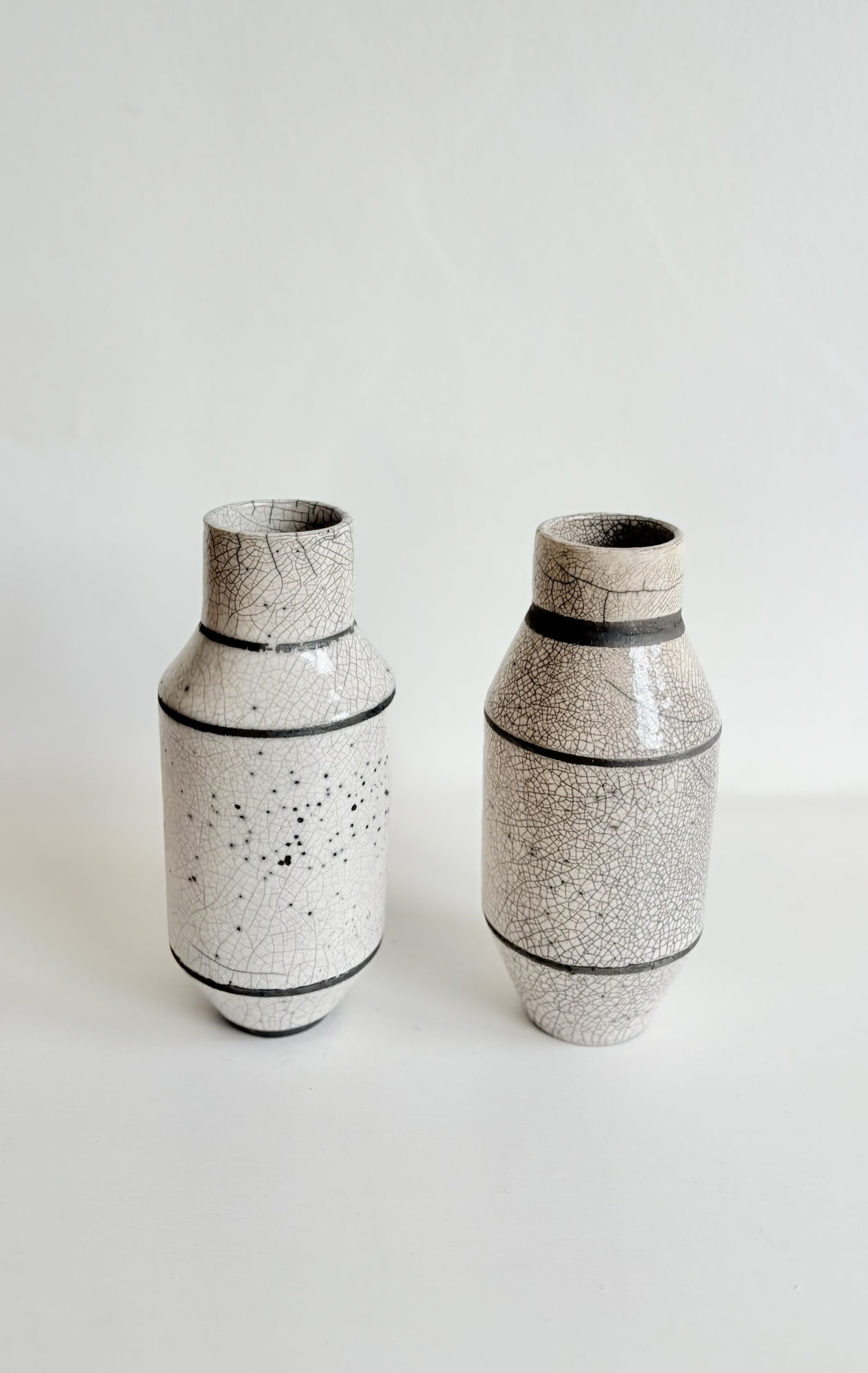 Violetta Papachristodoulou Raku Twin Vases White crackled glaze and blackened raw clay 21x 9,5cm each SOLD £475 - Set of two