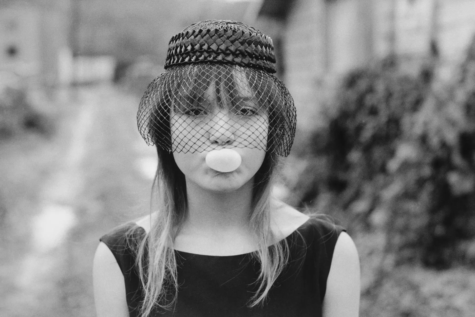 Tiny blowing a bubble (during "Streetwise"), Seattle, 1983 Gelatin silver print; printed later 11 x 14 inches