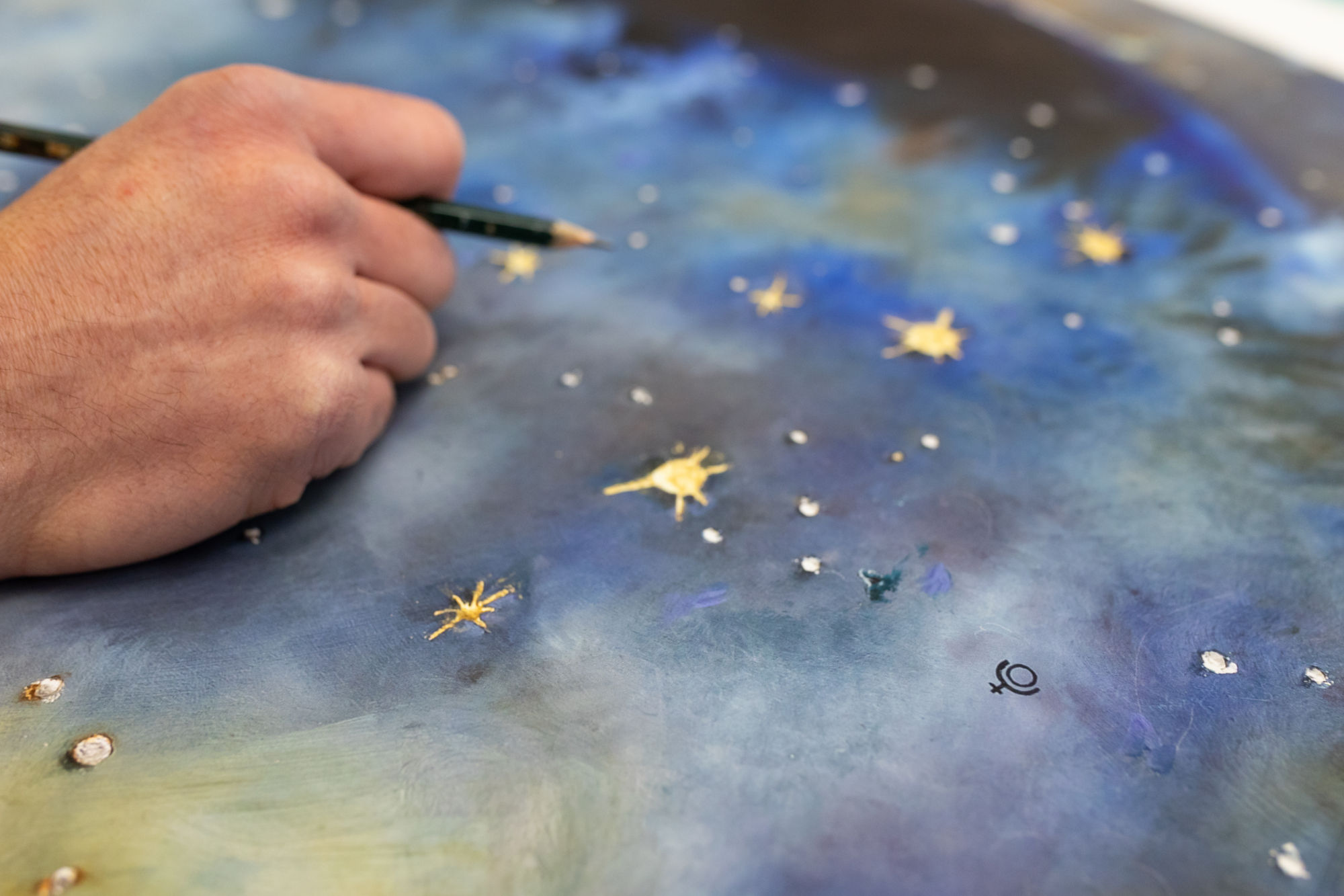 Chris Rivers hand embelishing his Scorpio Starmap print