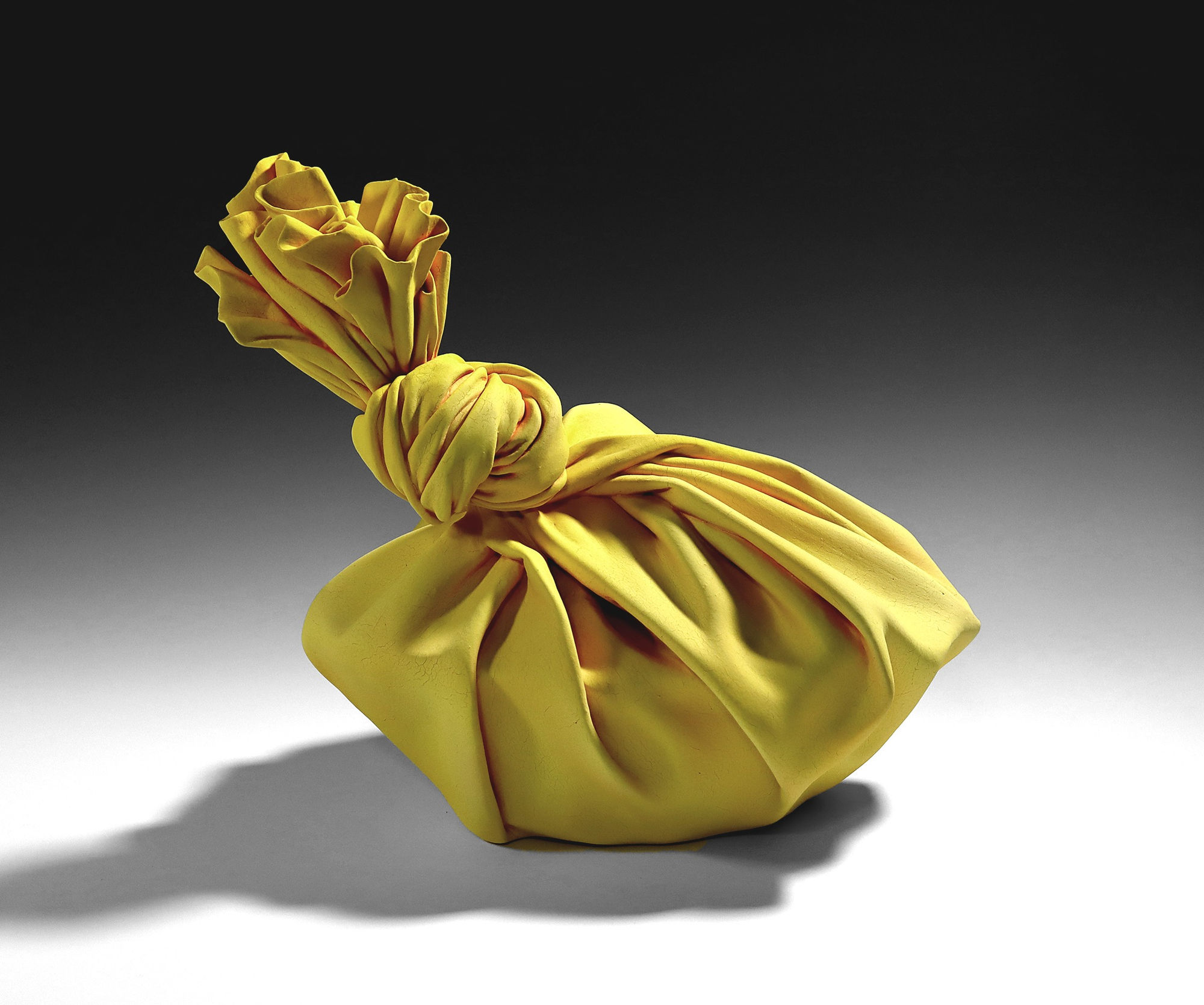 Tanaka Yū (b. 1989) Yellow sculpture in the shape of furoshiki (wrapping cloth) wrapping a round box 2020 Matte-glazed stoneware 13 3/8 x 15 x 13 in. Inv# 11724 SOLD