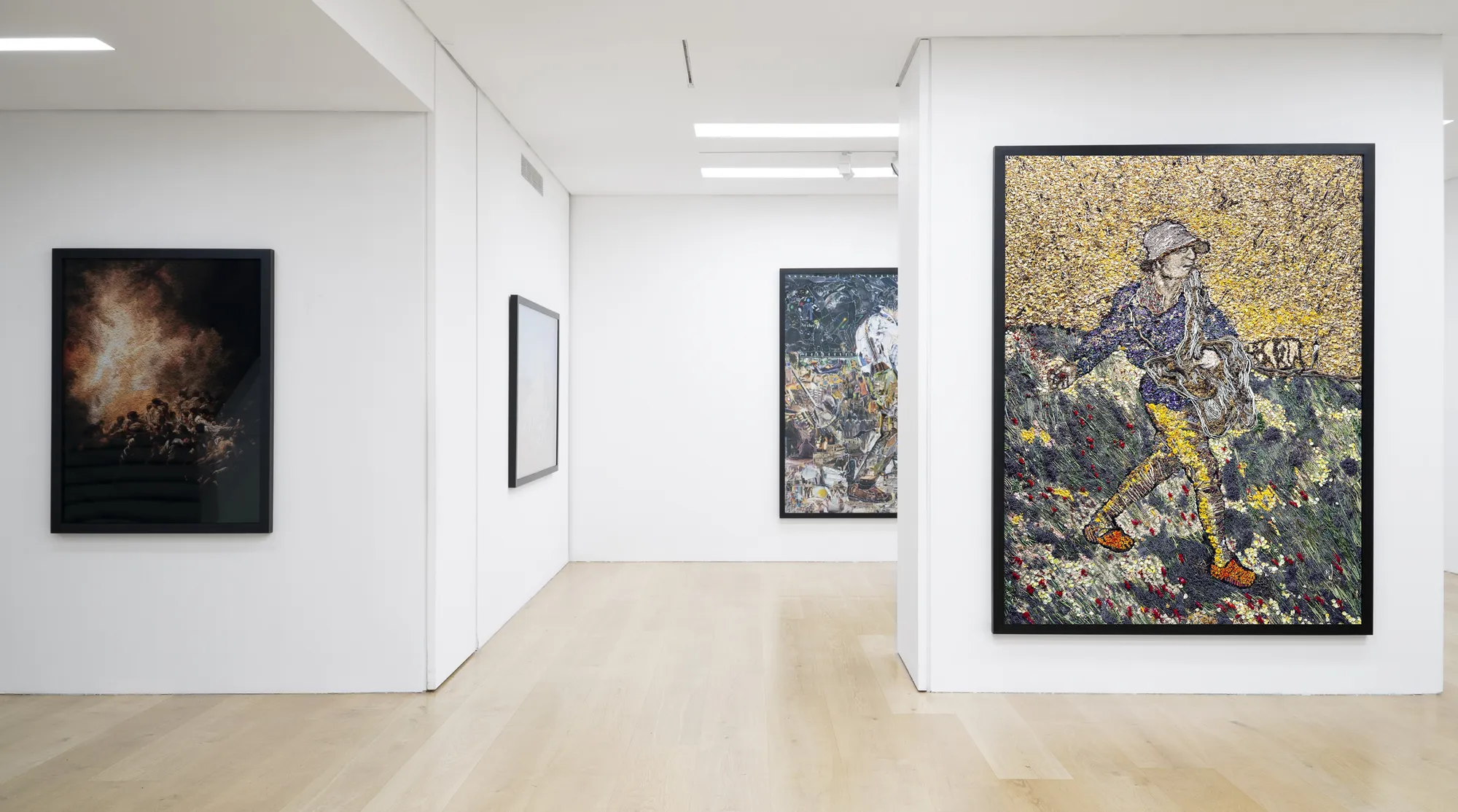 Installation view of a gallery with framed photo collages by Vik Muniz