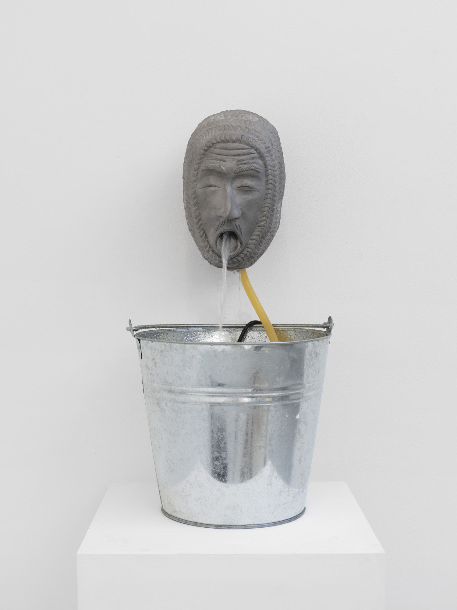 Dominic Watson, &lsquo;From the Land of Milk and Honey&rsquo;, 2023, Aluminium Head, Steel Bucket, water pump, Cider, 24 x 30 x 20 cm. &copy; The artist courtesy of Cob Gallery.