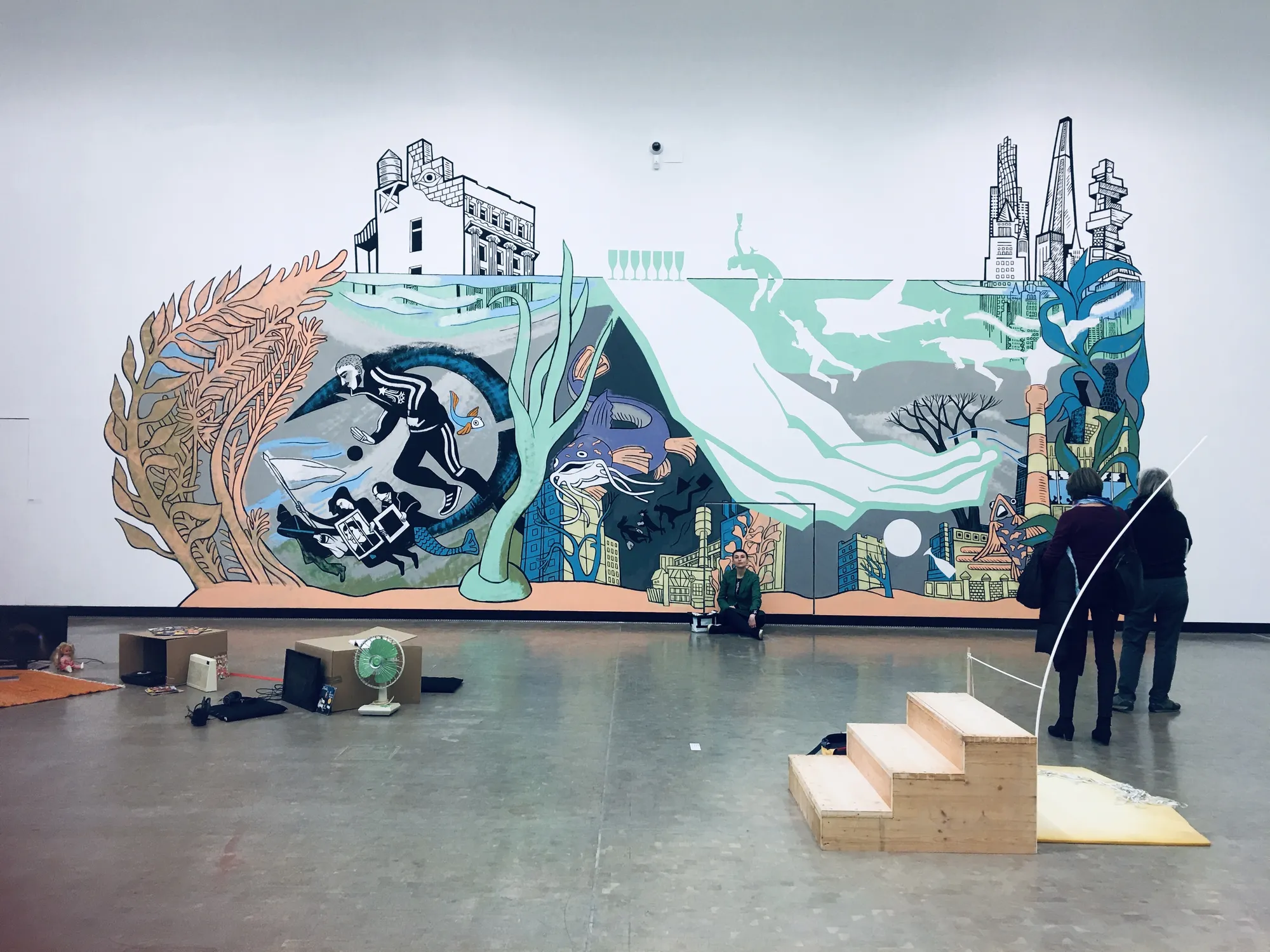 Victoria Lomasko with her mural Under Water, ... of bread, wine, cars, security and peace, Kunsthalle Wien, 2020