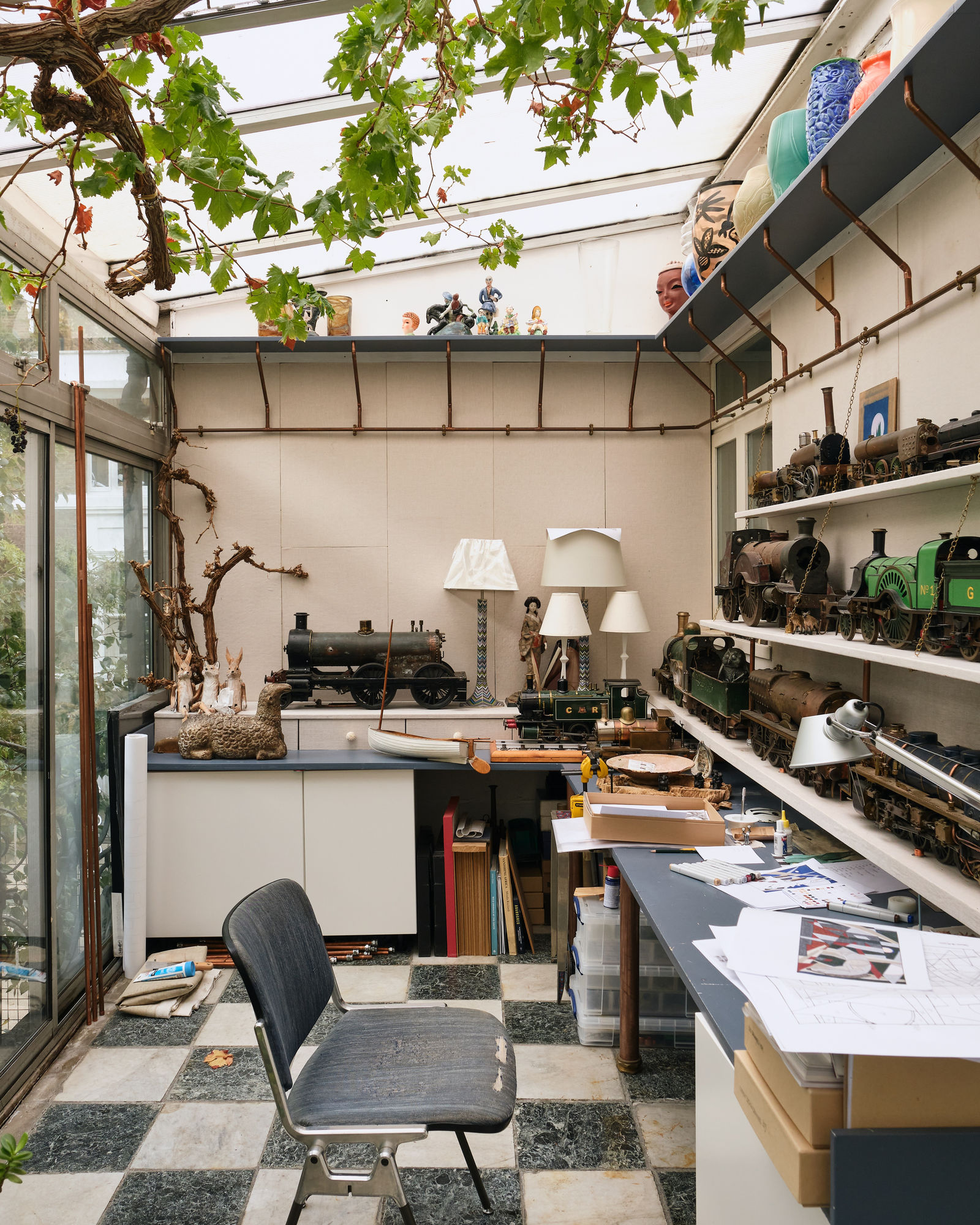 The greenhouse where Stuart works on model trains and his own artworks