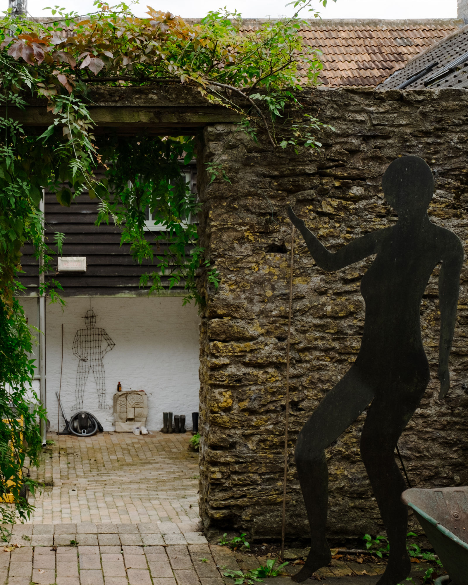 Henry Piper's sculpture 'Guiding Shadow' leads into a courtyard with another of his works, 'Top Fruit' made out of bed springs
