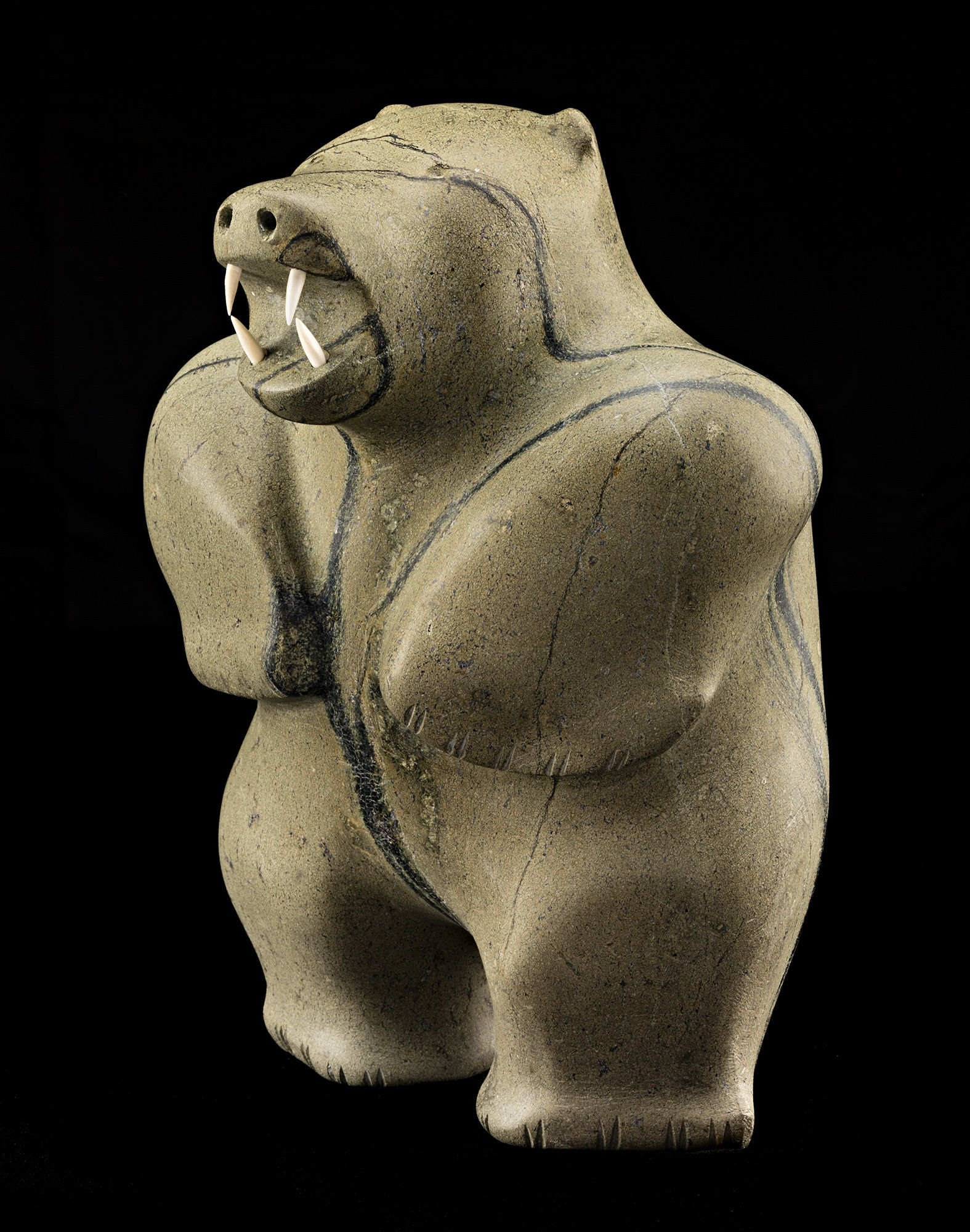 Lot 88 PAUTA SAILA, R.C.A. (1916-2009) m., KINNGAIT (CAPE DORSET) Standing Polar Bear, early 1970s stone and ivory, 12 x 8.75 x 9 in (30.5 x 22.2 x 22.9 cm) Estimate: $20,000⁠⁠⁠— $30,000 Price realized: $20,400