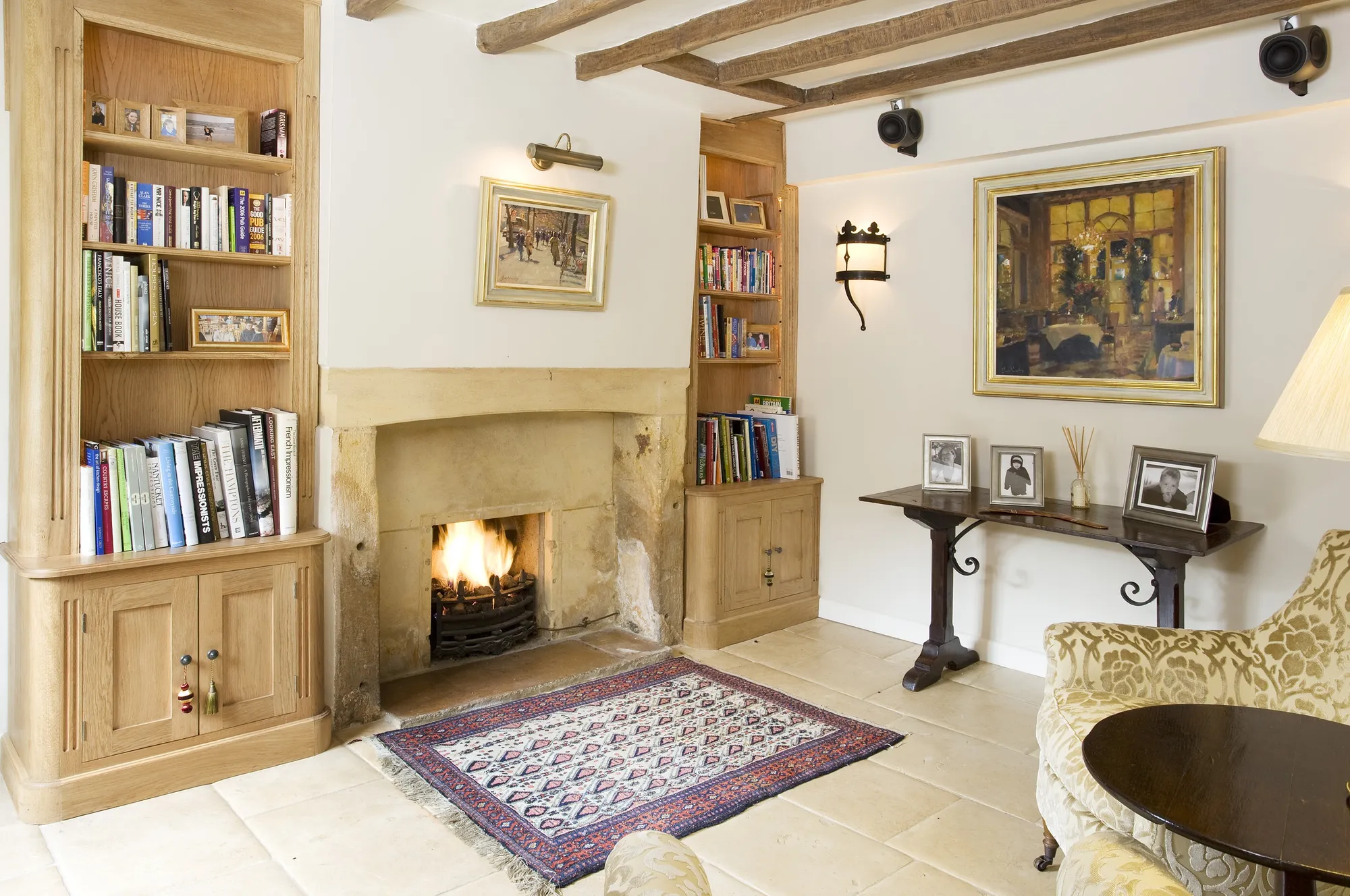 Original paintings by Bruce Yardley in this Cotswold cottage entrance hall