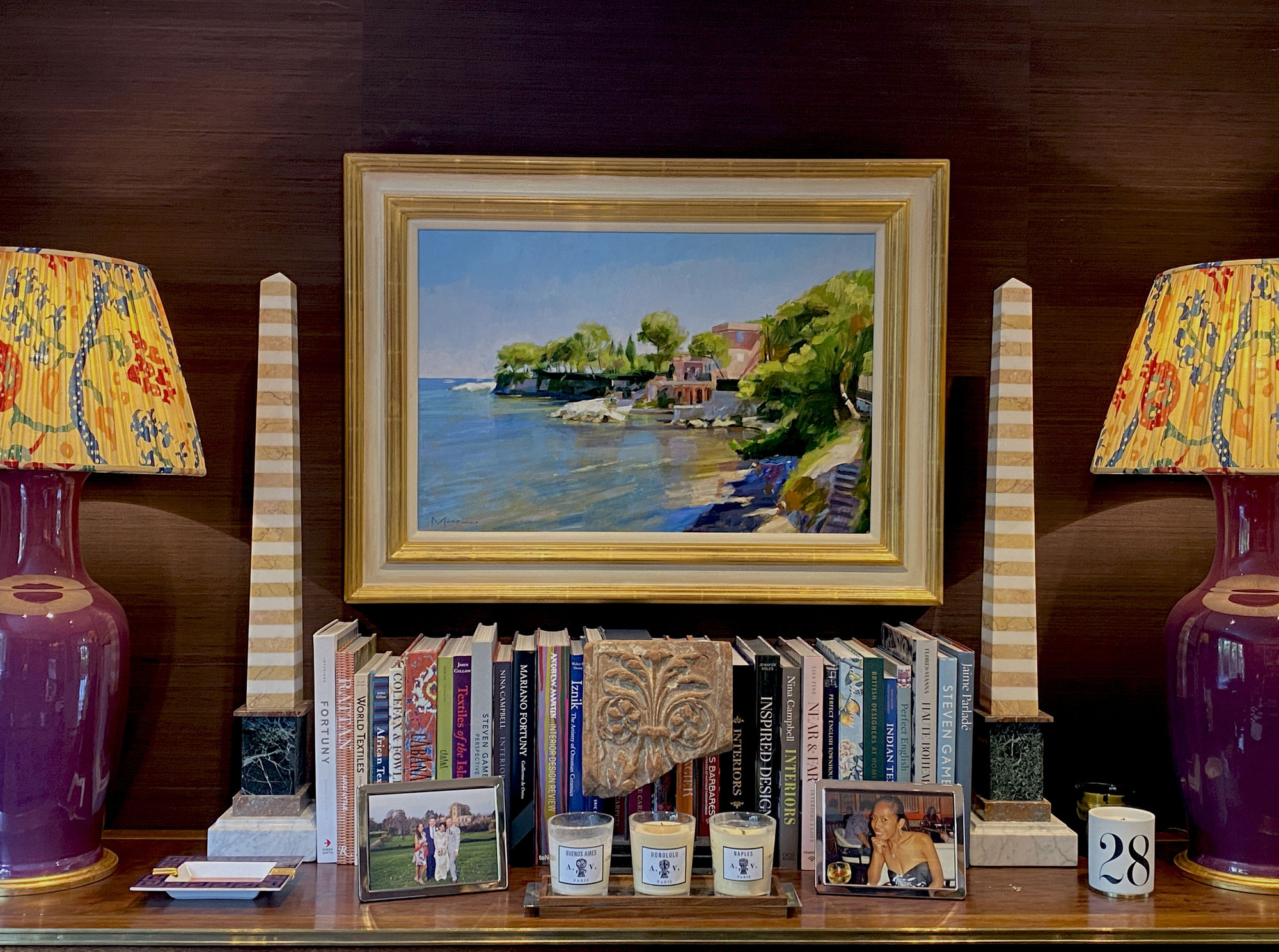 Marble obelisks either side of an original oil painting by Jack Morrocco