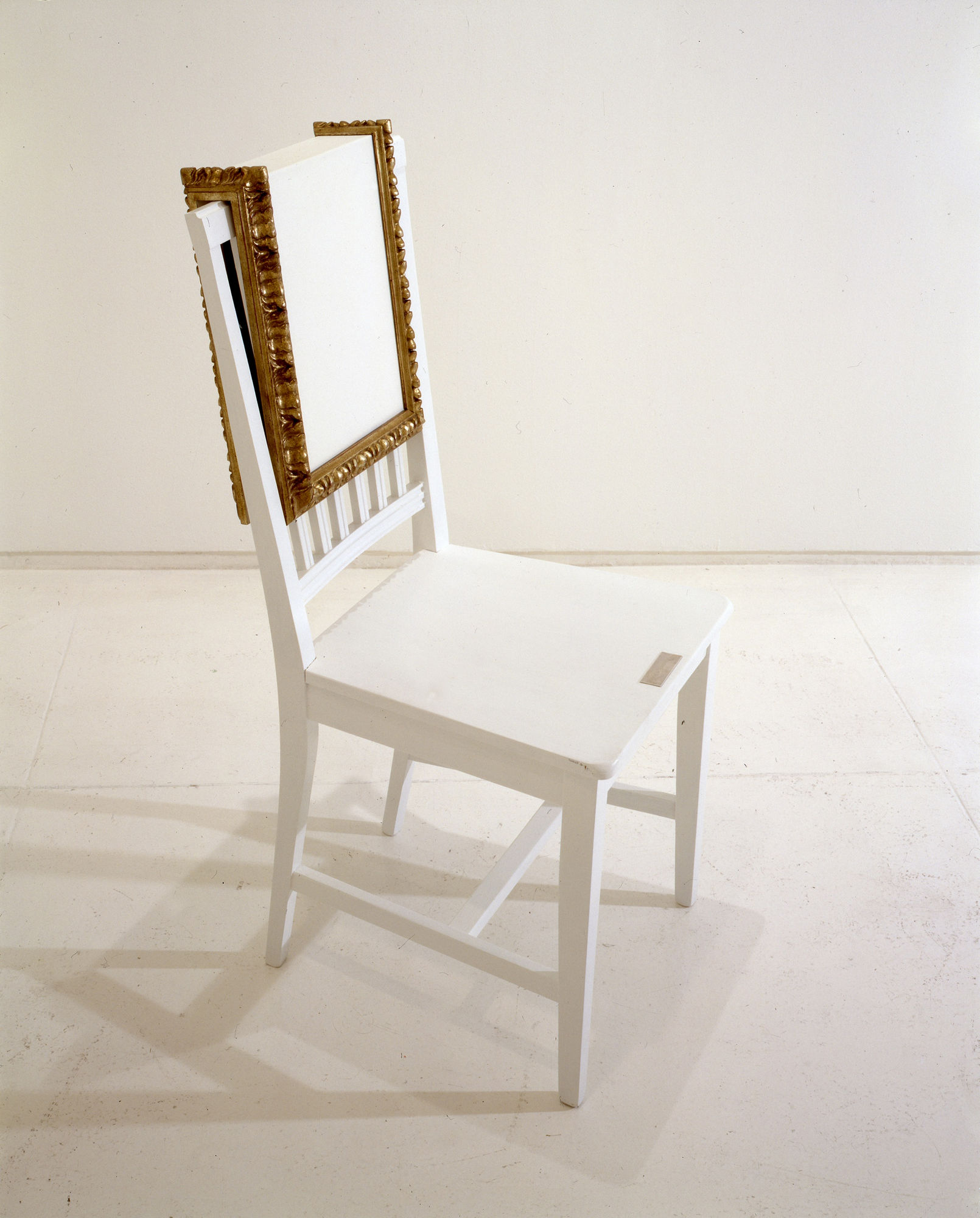 Yoko Ono Chair Painting, c. 1966-71/1996 White primed canvas over wood with silver leaf gilt frame, wooden chair painted white, metal plaque Framed canvas: 16 x 13 x 4 inches (40.6 x 33 x 10.2 cm) Wooden chair: 38.25 x 17 x 16.25 inches (97.2 x 43.2 x 41.3 cm) Edition of 3 + 2 APs
