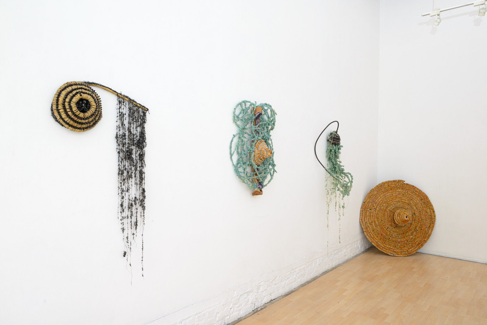 Installation view of Lucien Shapiro's solo show "Oculus", featuring found-object ritual sculptures