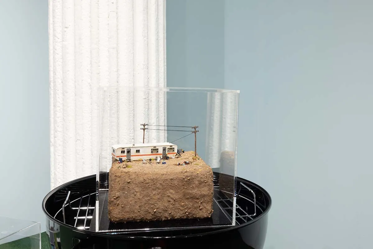 Abigail Goldman dieorama of RV murder scene in rocky / dirt landscape sitting on grill