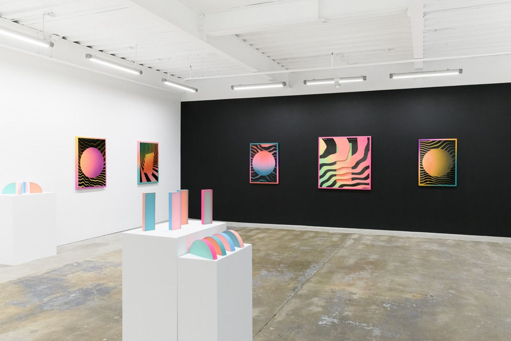 Install image of "Cosmic Bloom," from left to right, Rachel Strum's "MOONSAFARI," "LIGHTFIZZ," "GLEAMINGLOOP," "WAVEFORMPORTAL," "BLACKHOLEGLOW." Front and left installed Rachel Strum's sculptures.