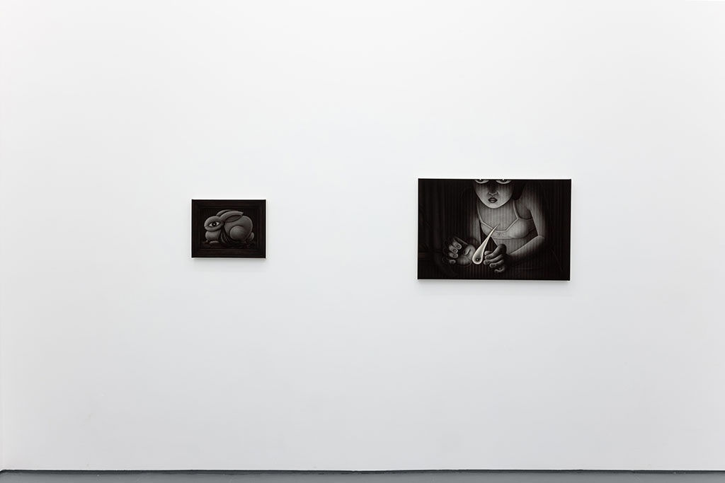 Installation view of Angela Fang Zirbes exhibition "House & Ghosts" featuring two greyscale paintings on a white wall