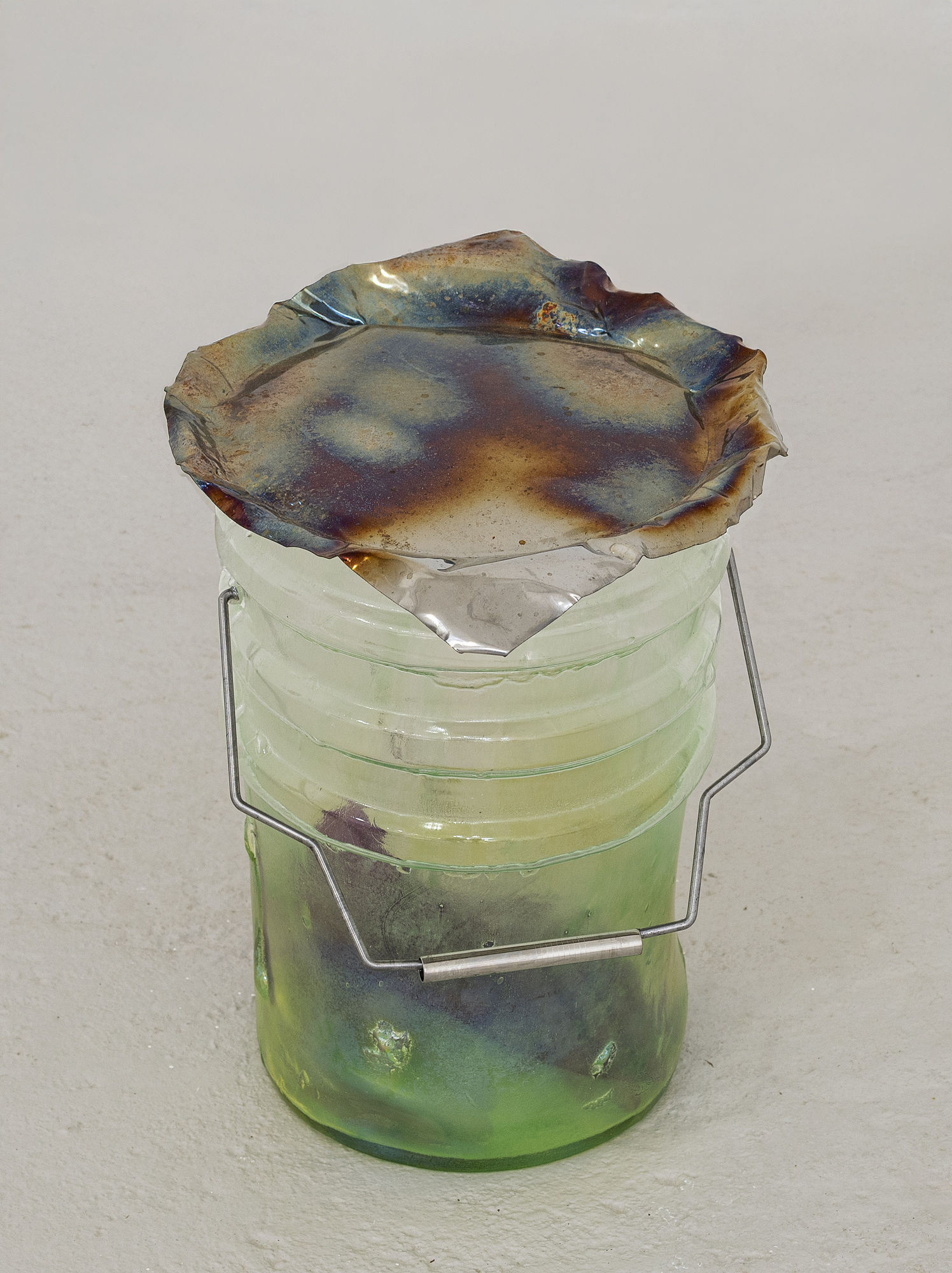 Catherine Telford Keogh Dust Gardens (Thermal Insulation), 2025 Mold-blown glass (Leaktite™ 2-gallon white plastic pail), formed stainless steel, steel rod, stainless steel drinking straw, handmade latex gloves, compressed landfill dust, stained glass stainless 15 x 10¼ x 10¼ inches 38.1 x 26 x 26 cm