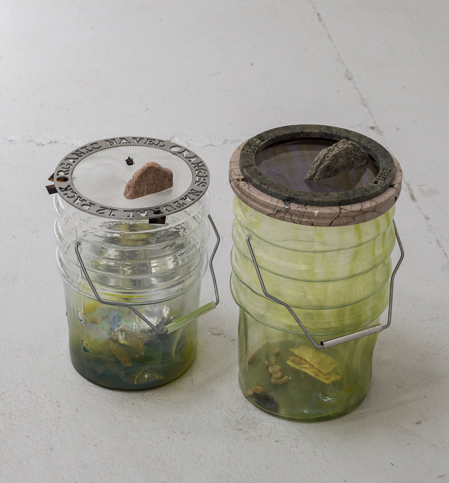 Catherine Telford Keogh Dust Gardens (Weathering Preserved Foods), 2025 Mold-blown glass (Leaktite™ 2-gallon white plastic pail), waterjet cut pink Marble, waterjet-cut Verde Ubatuba granite, stained glass, split granite rock, cast silicone Premium Saltine Crackers®, Original, found pebbles, stainless steel drinking straw, steel rod, studio dust 17 x 10¼ x 10¼ inches 43.2 x 26 x 26 cm