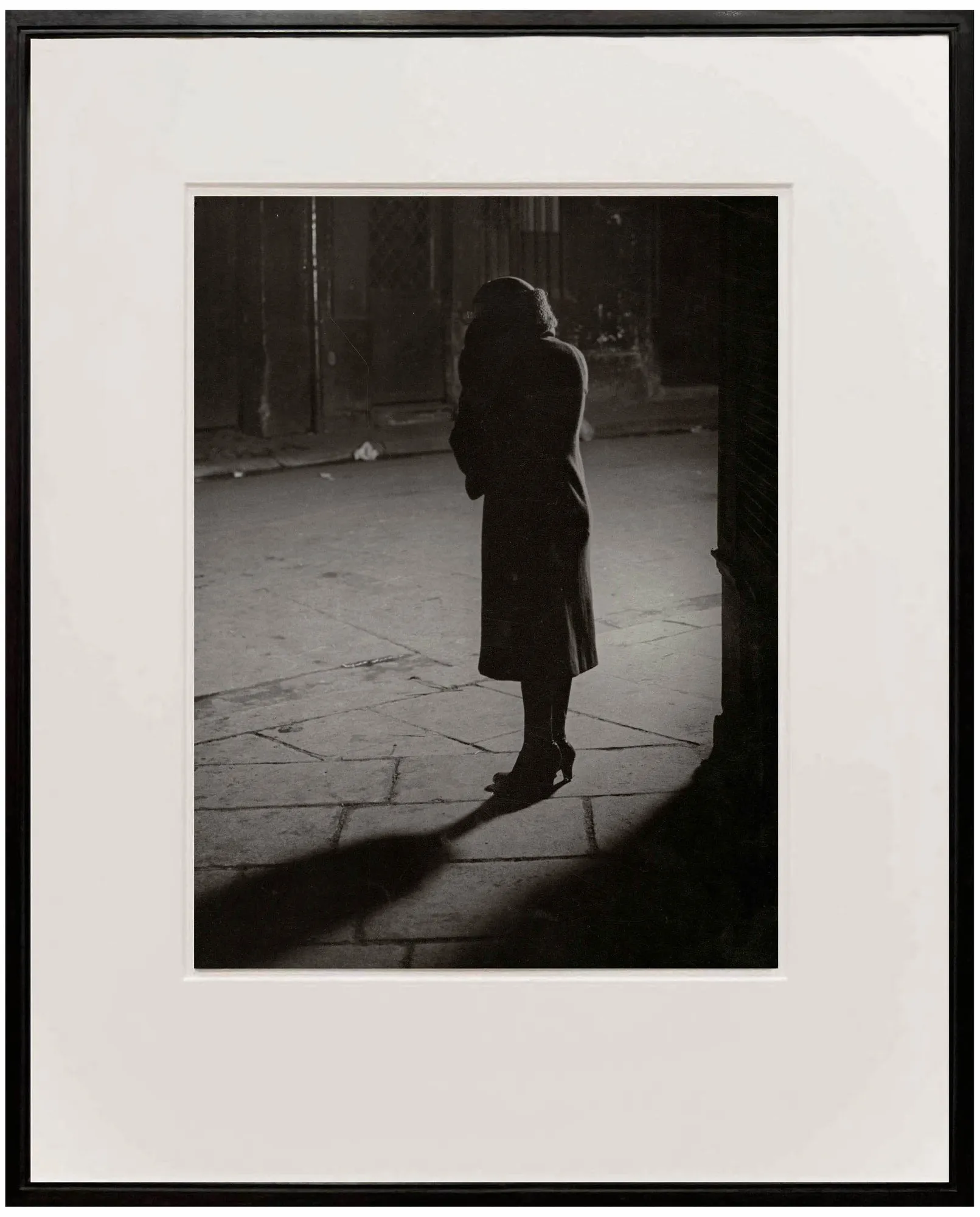 Woman on street at night by Brassai