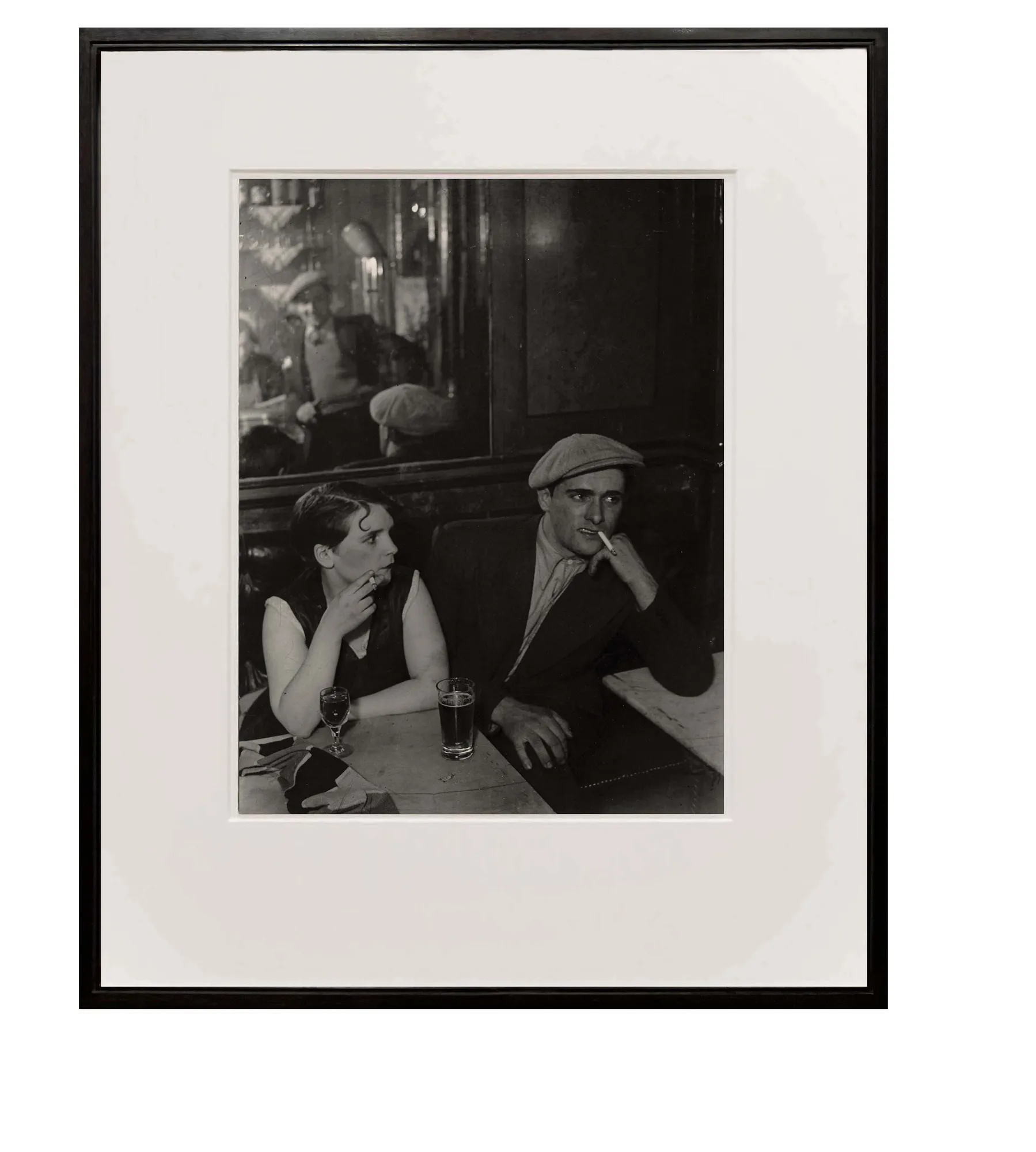 framed photograph of couple at a cafe at night from Paris de Nuit by Brassai