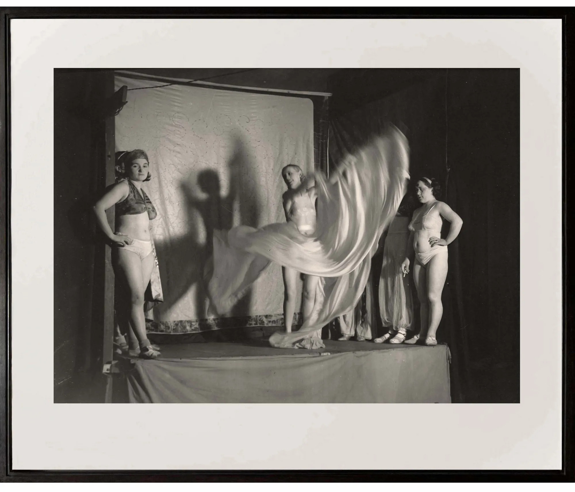 group of women on stage at the Fete Foraine from Paris de Nuit by Brassai