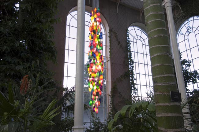 Candela 7/450 (For the Death Star) 2006 450 household bottles, low energy lamps, cable. Installed at the Victorian Palmhouse, Royal Botanic Gardens Edinburgh during the Edinburgh Art Festival in August 2006. image courtesy Ruth Clark