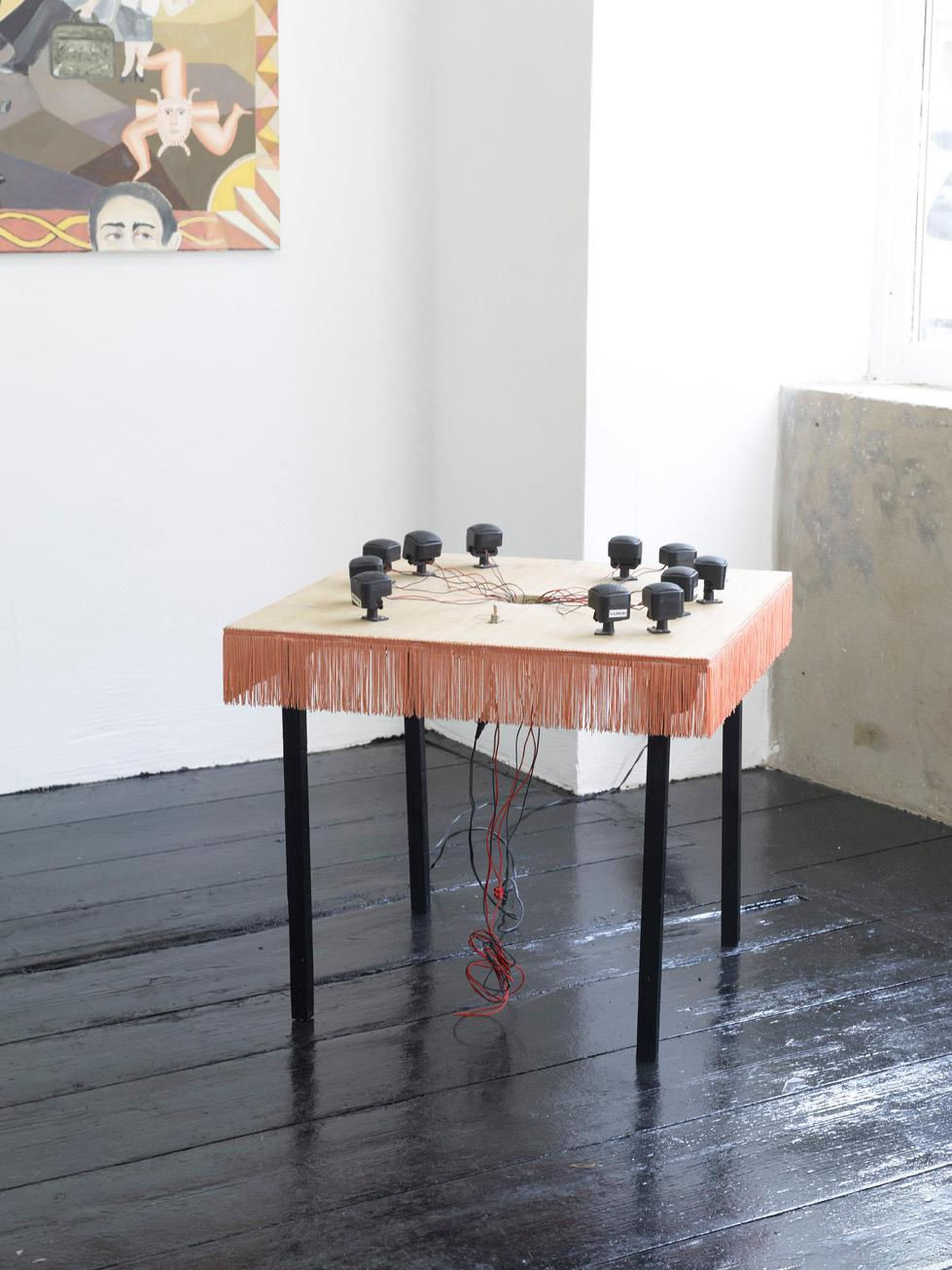 Katrin Plavcak, "Piezo Electric Table" (2012), 60x60x53, speakers with integrated circuits, fringe, wood