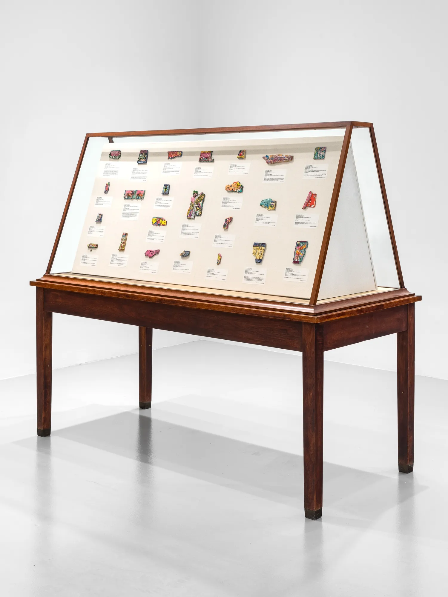 Michael Rakowitz The invisible enemy should not exist (Vitrine 2 - ivories), 2023 Glass vitrine, Middle Eastern food packaging and newspaper, glue 68 x 78 x 36 1/4 in 172.7 x 198.1 x 92.1 cm