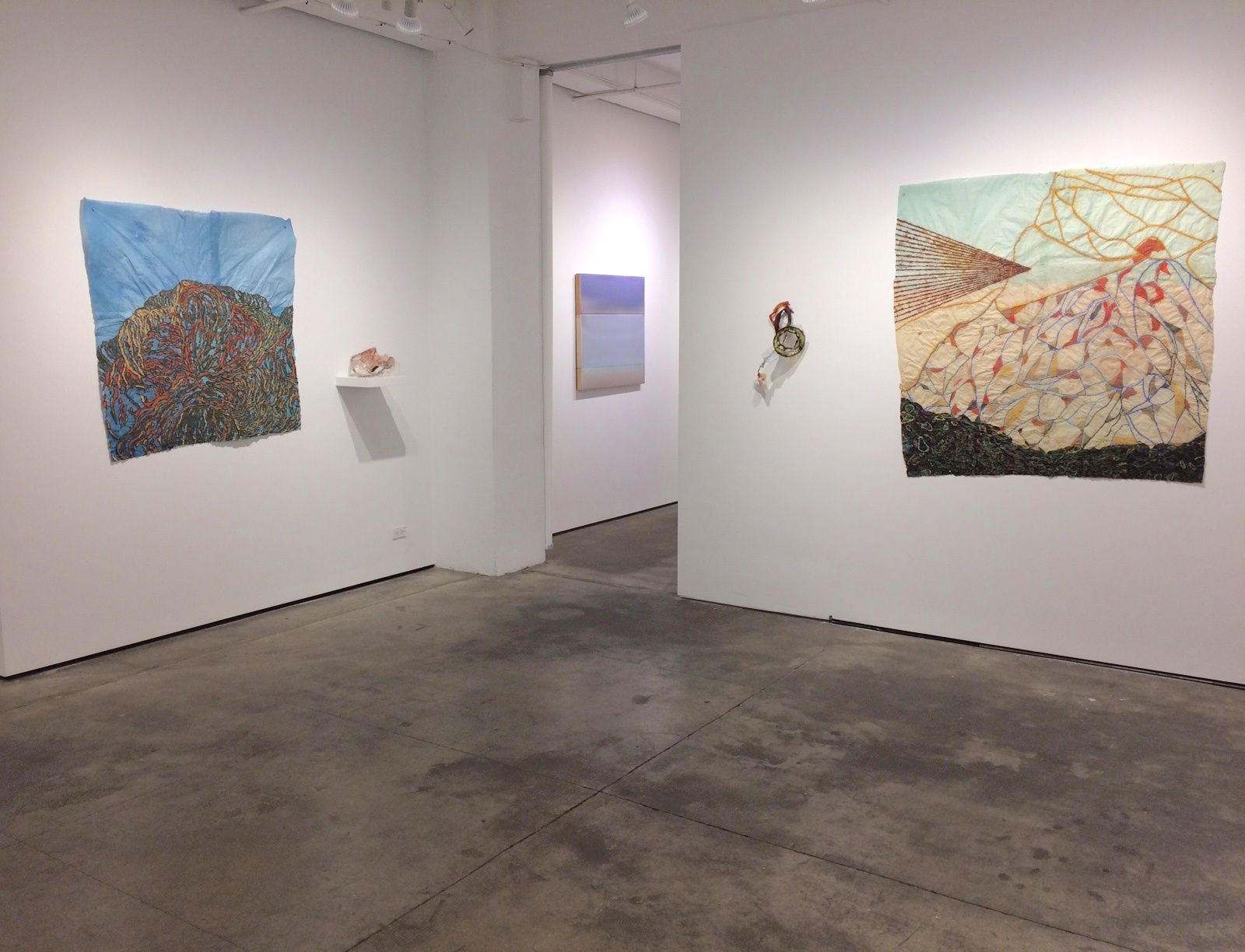 Installation shot of four different works by Nancy Cohen. An additional piece by Susan English can also be seen.
