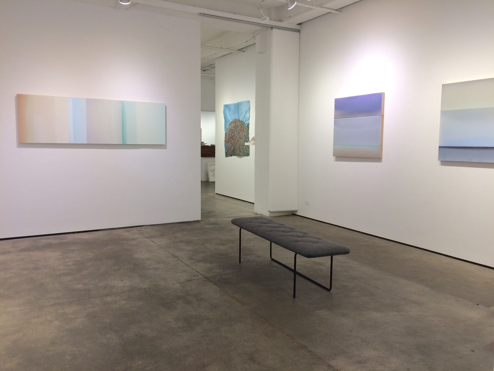 Installation shot of three works by Susan English and a work by Nancy Cohen. 