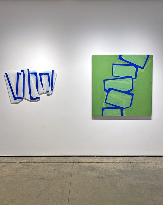 Steven Baris's Dys/Junctures k8 (left) next to his Toppling E1 (Right) hanging on the gallery wall 