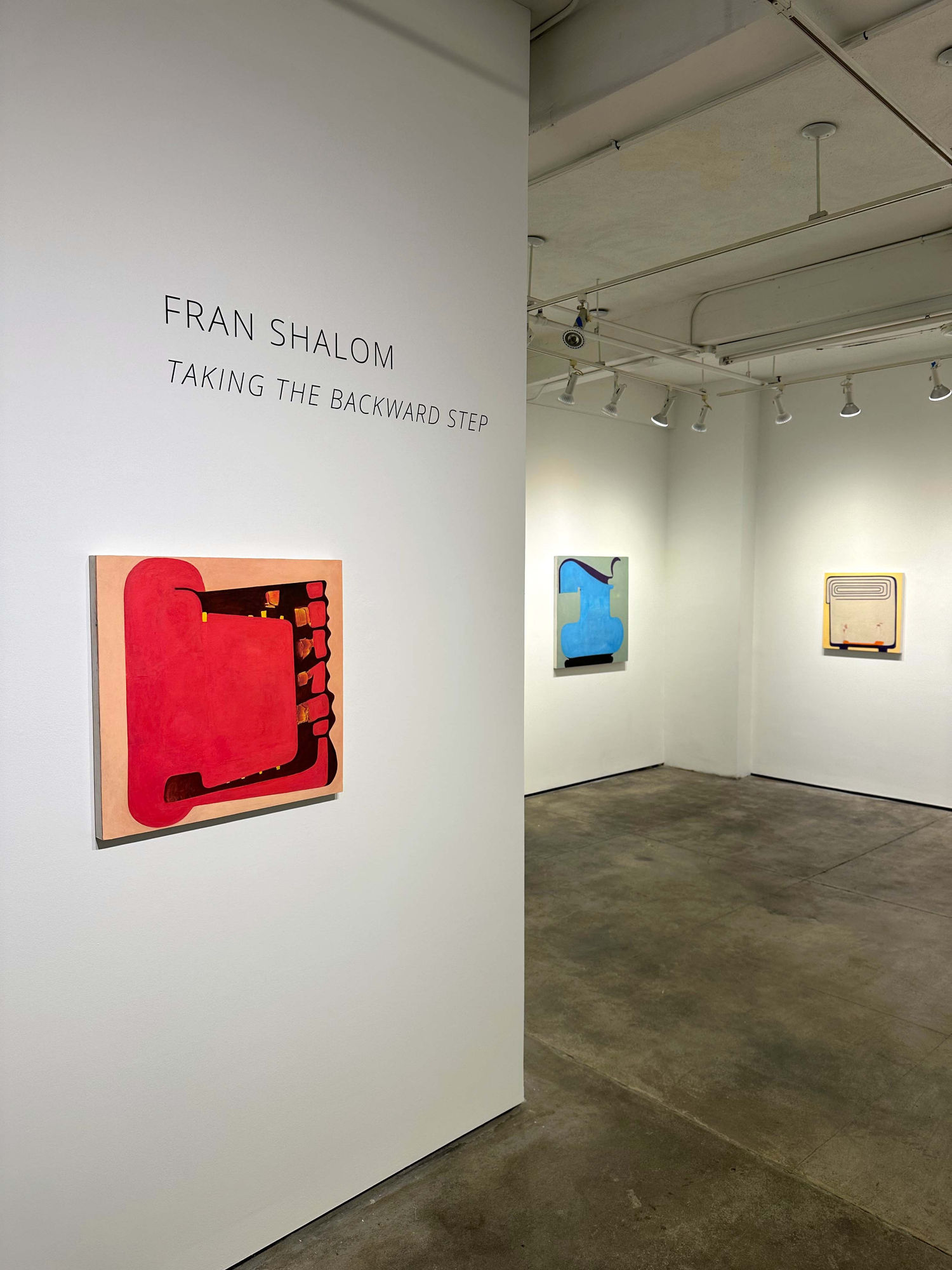 the exhibition: taking the backwards step, by fran shalom, with three paintings visible