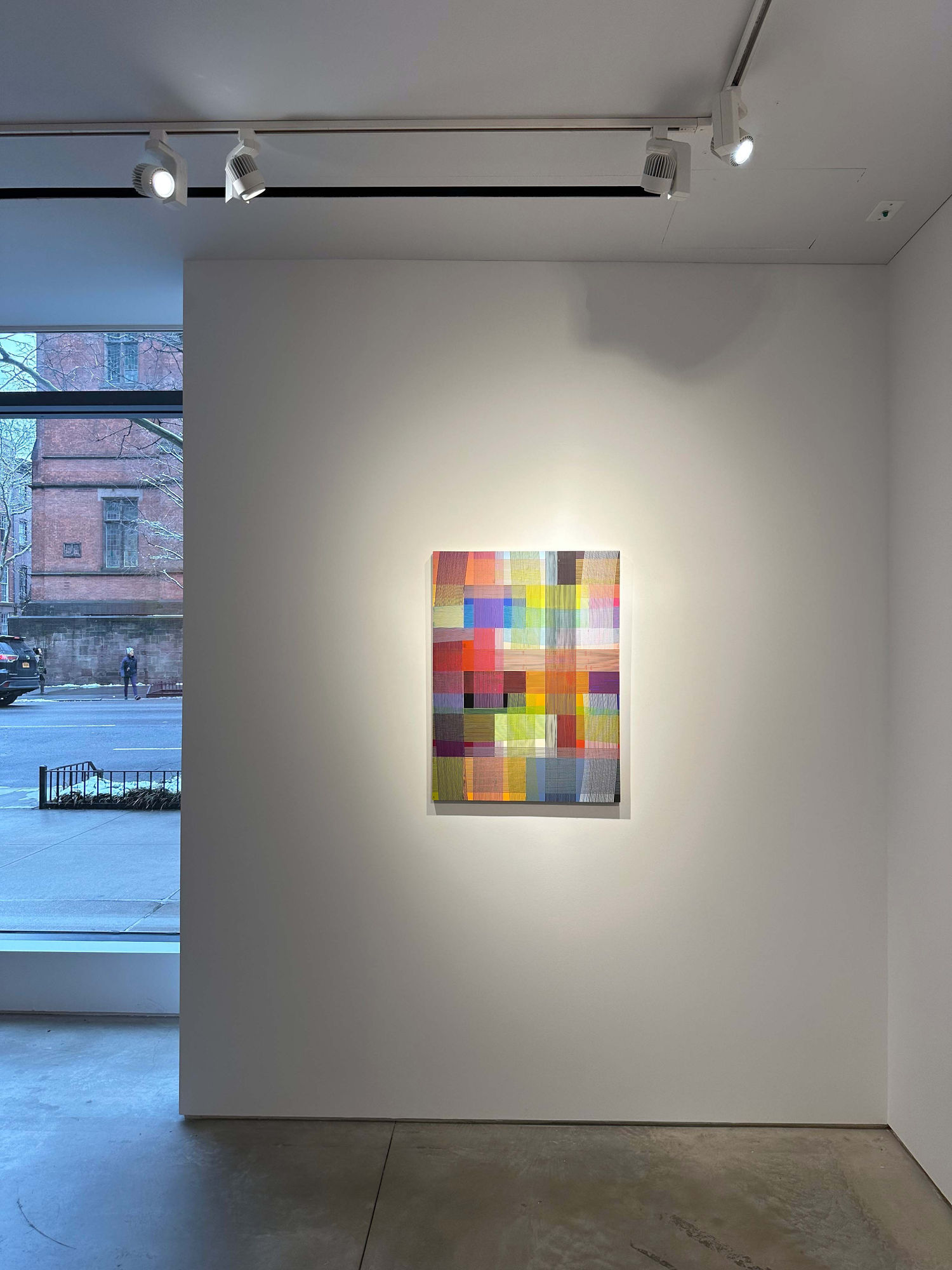 photo of an installation with one abstract painting visible 