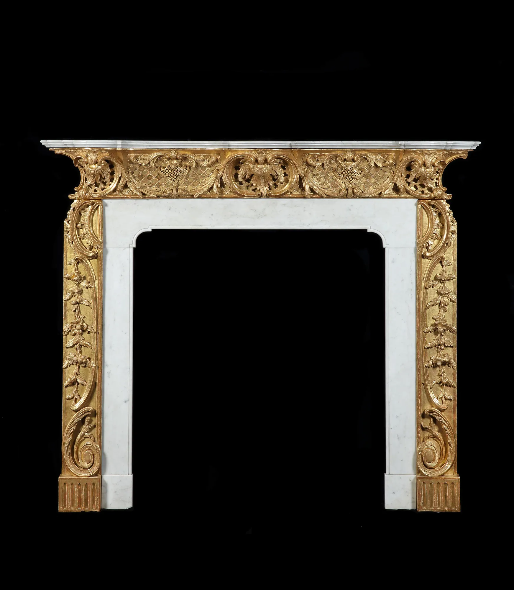 A GEORGE II CHIMNEYPIECE TO A DESIGN BY THOMAS JOHNSON