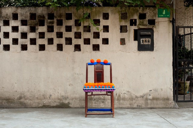 'Antique Chair, Revisited' (pink) Antique Chinese wood chair dressed in wool pom poms and 'buttons'