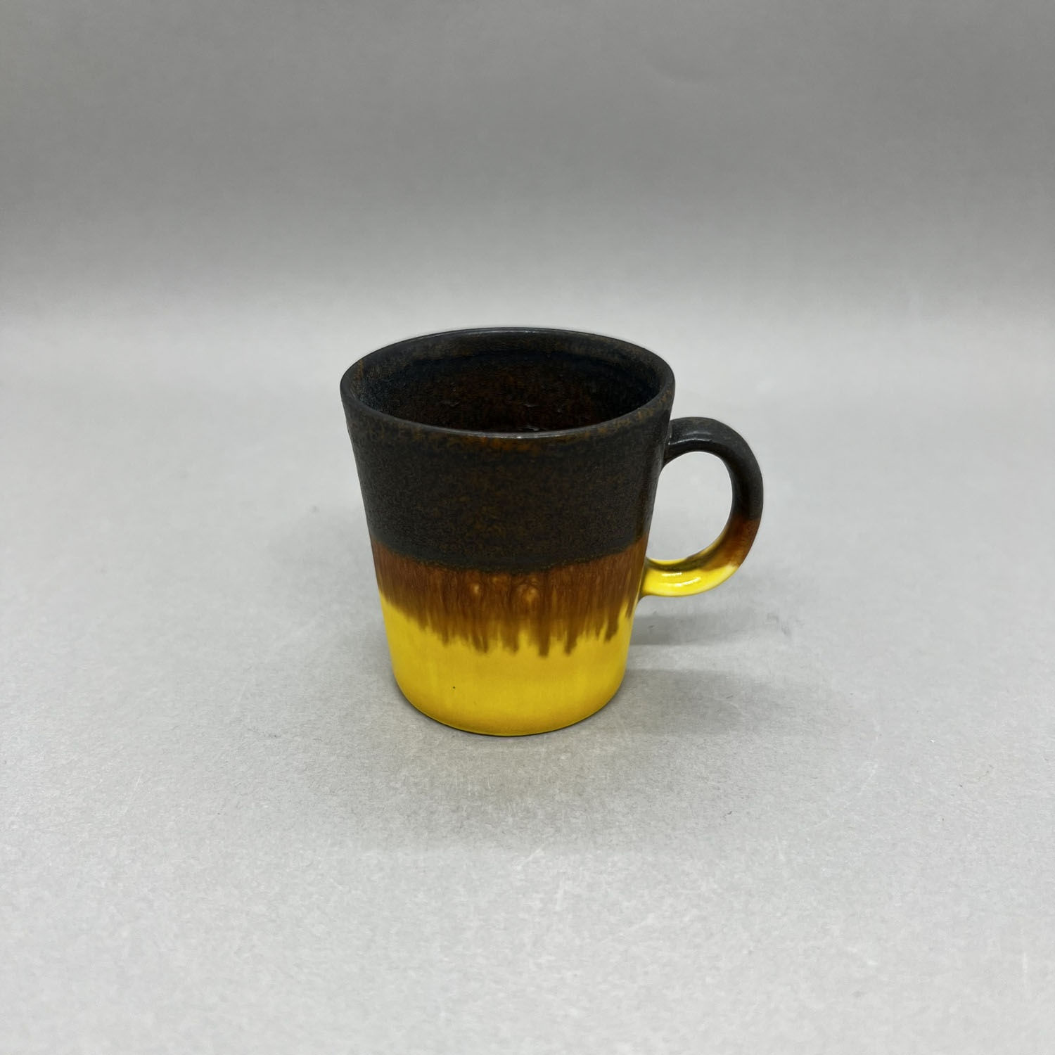 Yuta Segawa espresso cup in a black and lemon yellow glaze