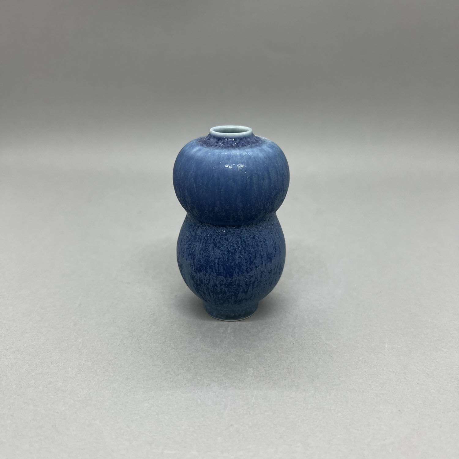 Yuta Segawa miniature vase in a bulbous tiered urn shape with a deep blue sparkled glaze