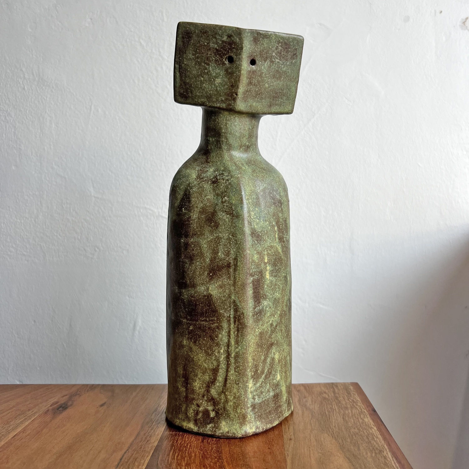 Peter Slight Cycladic ceramic figure with turquoise and bronze speckled glaze and pentagon shaped head with two holes for eyes