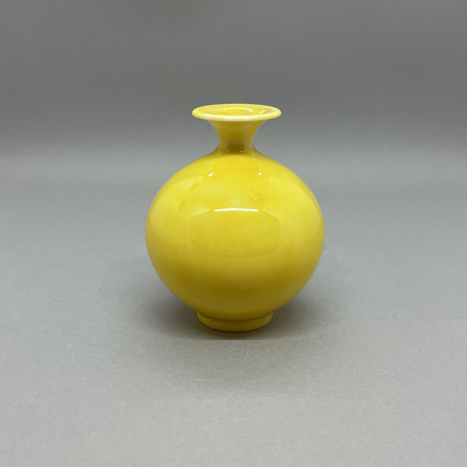Yuta Segawa miniature vase in a rounded bottle shape with a lemon yellow glaze