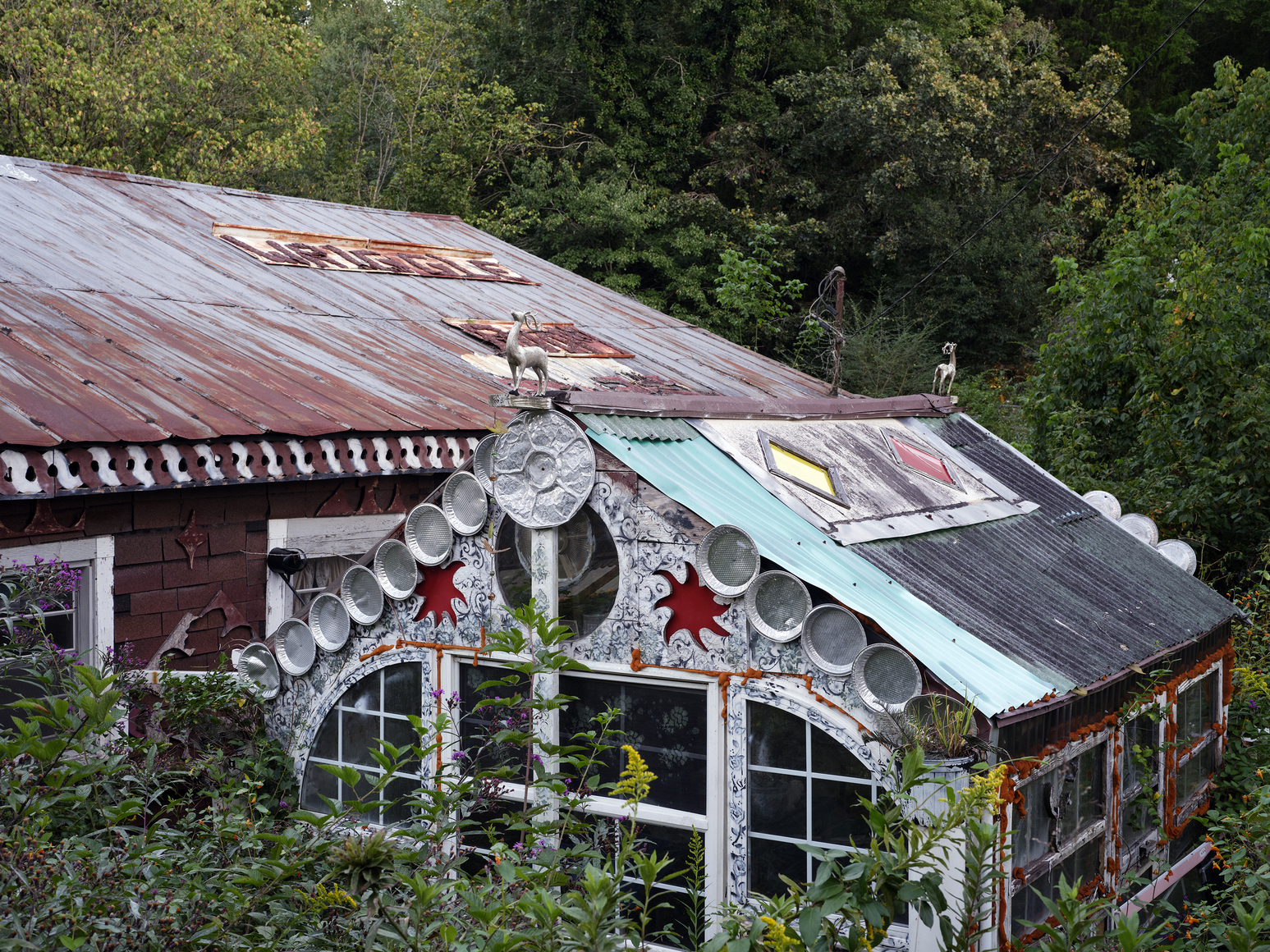 Two house like structures that are forgotten