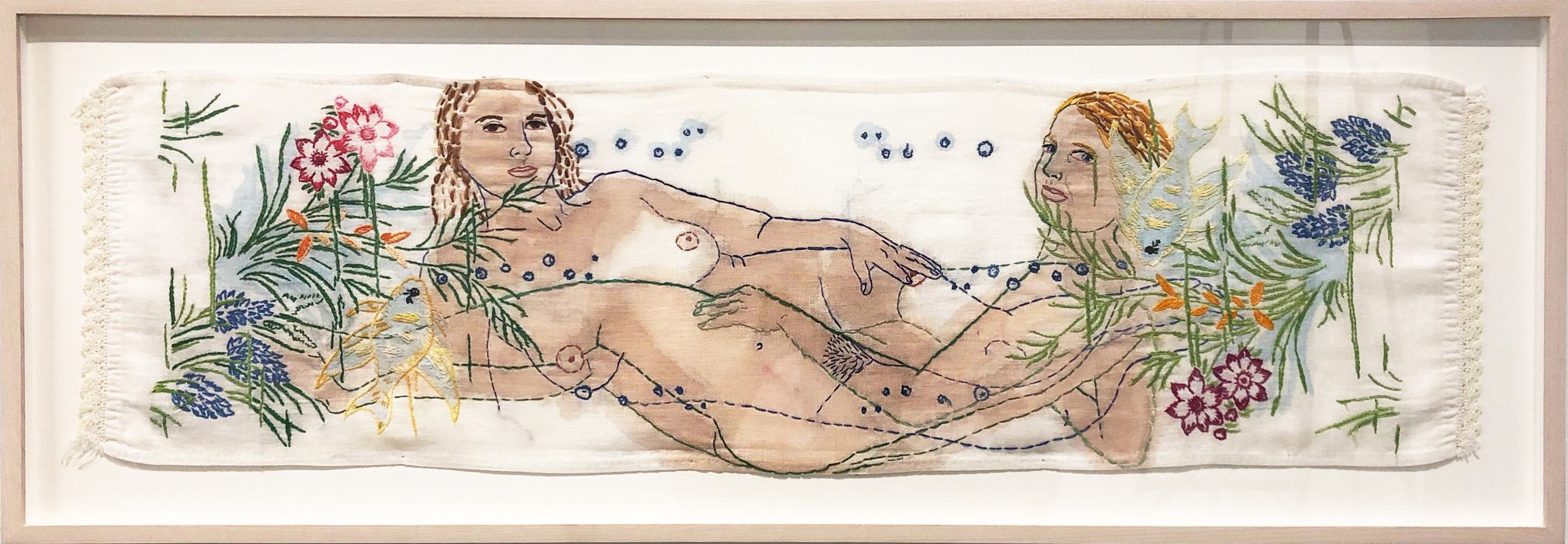 Embroidery of a woman on vintage linens