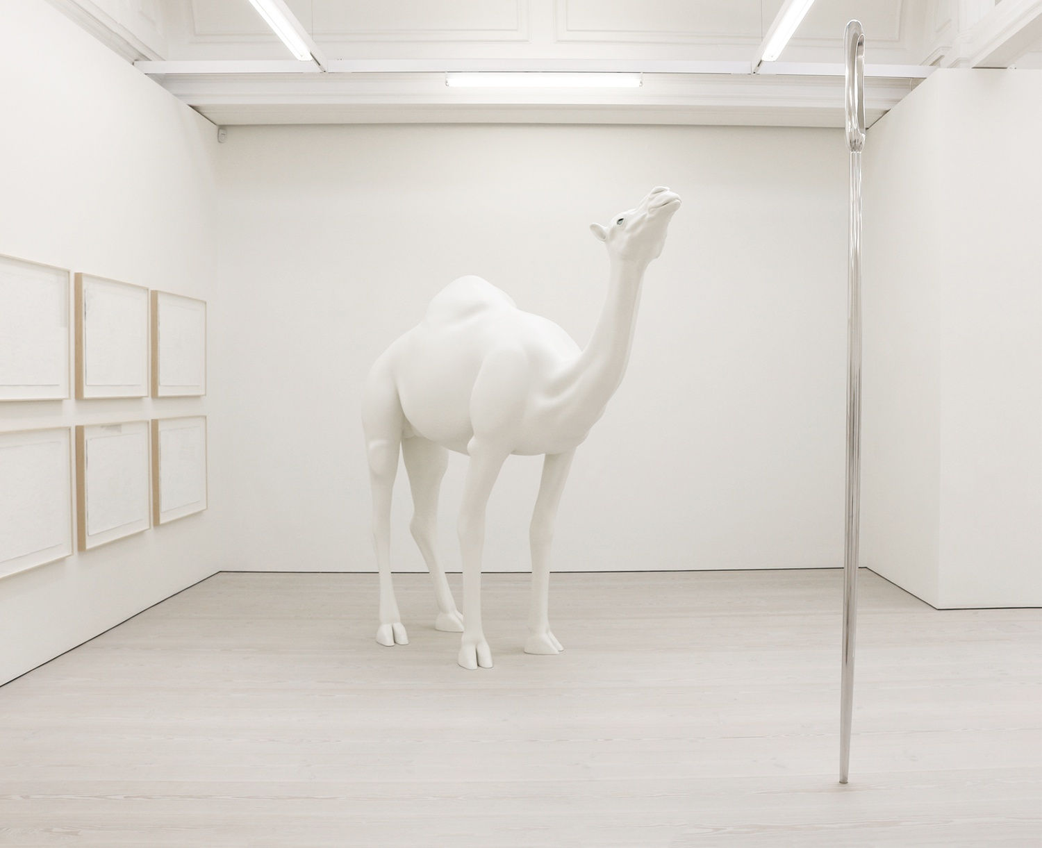 Gallery view of white camel statue with blue eyes.