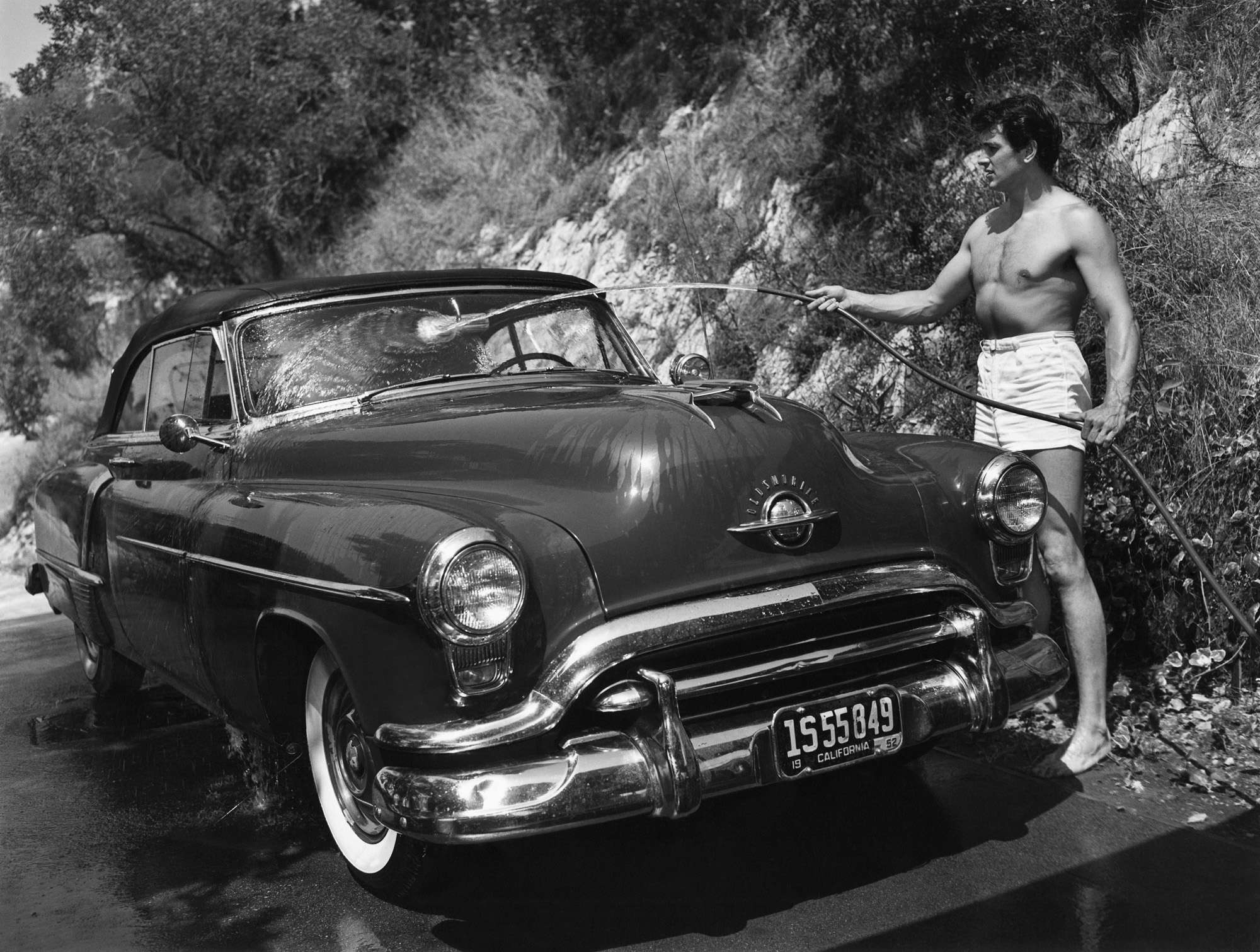 Rock Hudson Washing His Car Outside His Hollywood Home