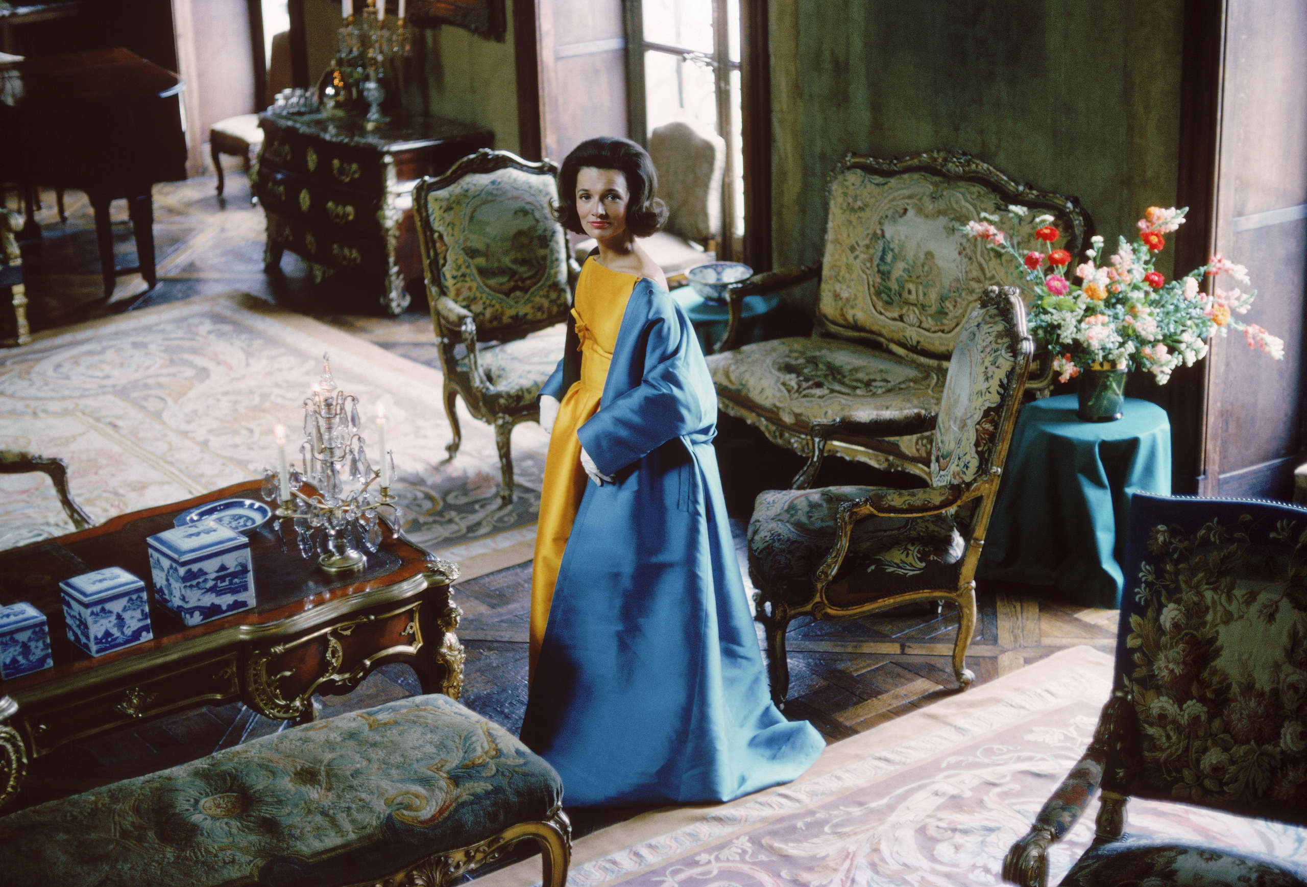 Socialite Lee Radziwill (Blue Cape in Brocade Room. Her blue cape and gold satin dress are by Nina Ricci)