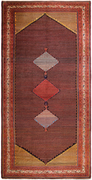 this rectangular antique saraband rug contains three diamonds going down vertically encased in a long hexagonal shape. the diamond's colors are light blue, red, and light blue. there are several small motifs lining the entire rug which creates a bit of a dotted effect on the rug.