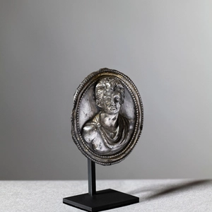 Roman medallion of a young man in relief, c.1st century AD