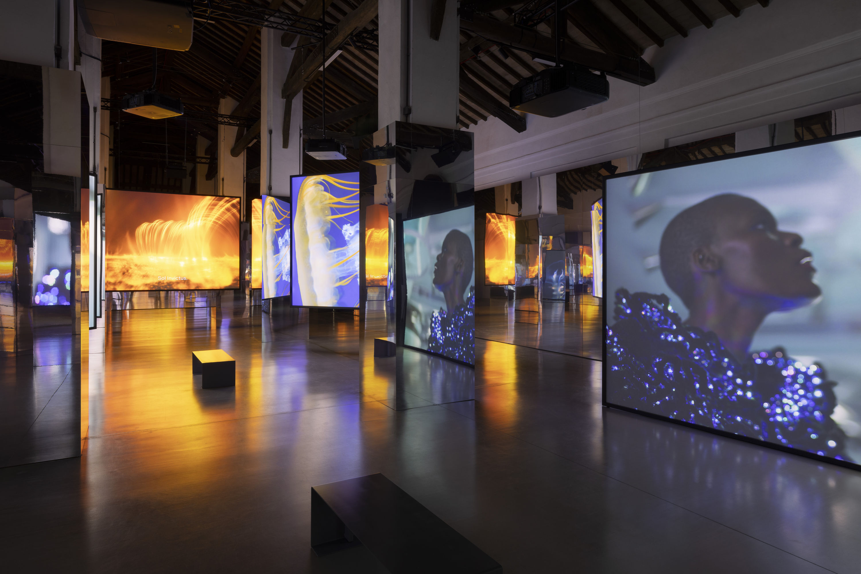 Installation view, All That Changes You. Metamorphosis, 2025, Palazzo Te, Mantua Ten-screen film installation, 4K Video, colour, 10.2 surround sound,...