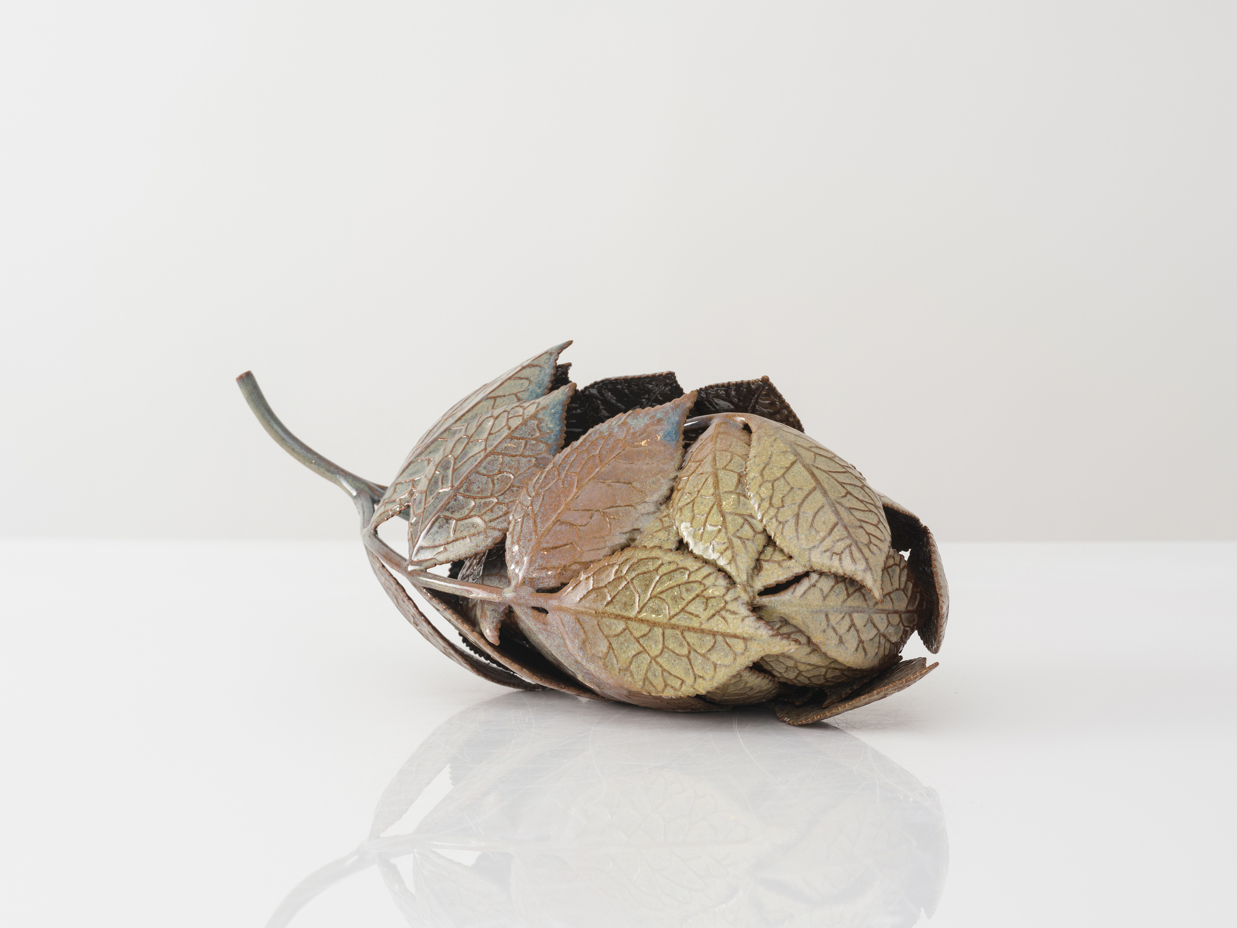 Marianne Nielsen, Elder Twig No. 2, 2024, glazed stoneware, 6.5 x 16.5 x 7 in, photography by Joe Kramm. Courtesy of Hostler Burrows x HB381.