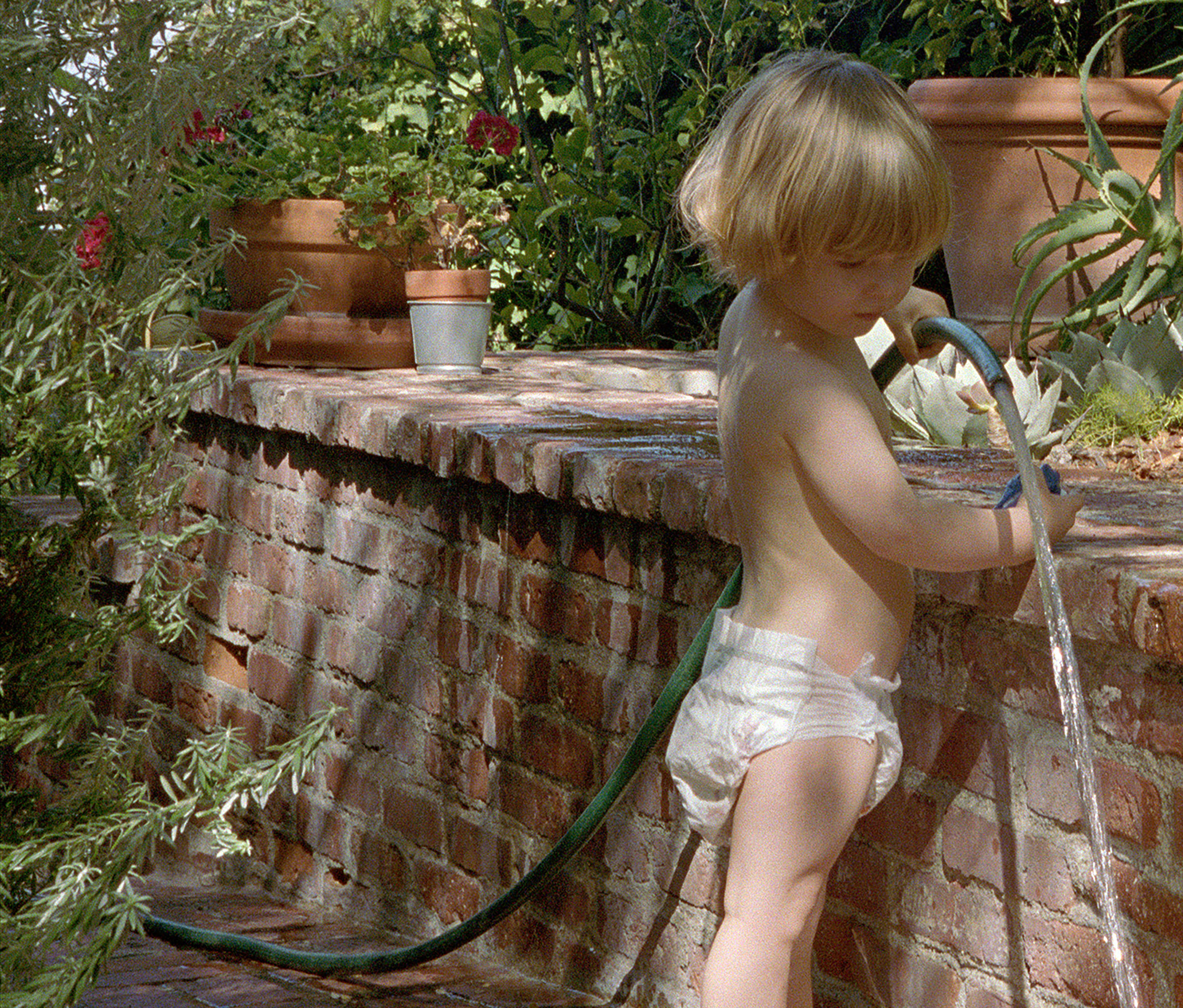 Torbj&oslash;rn R&oslash;dland, Child with Garden Hose, 2024 - 2026