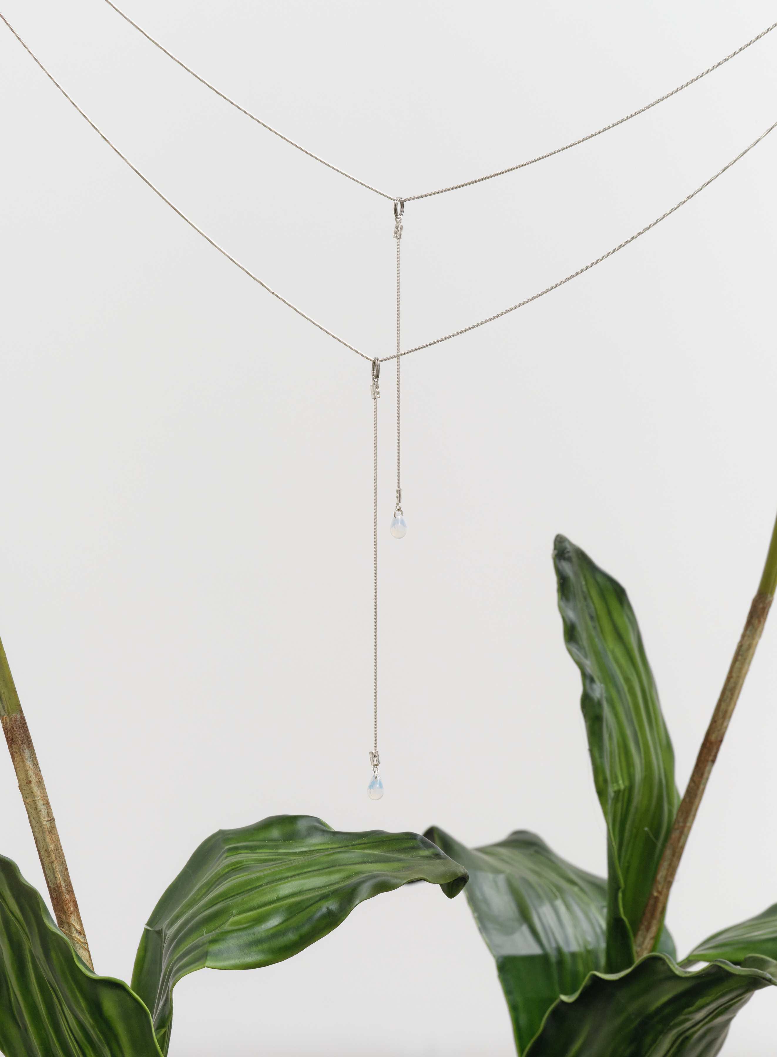 A detail of pendant necklaces in Rachel Youn's "Perfect Lovers II"