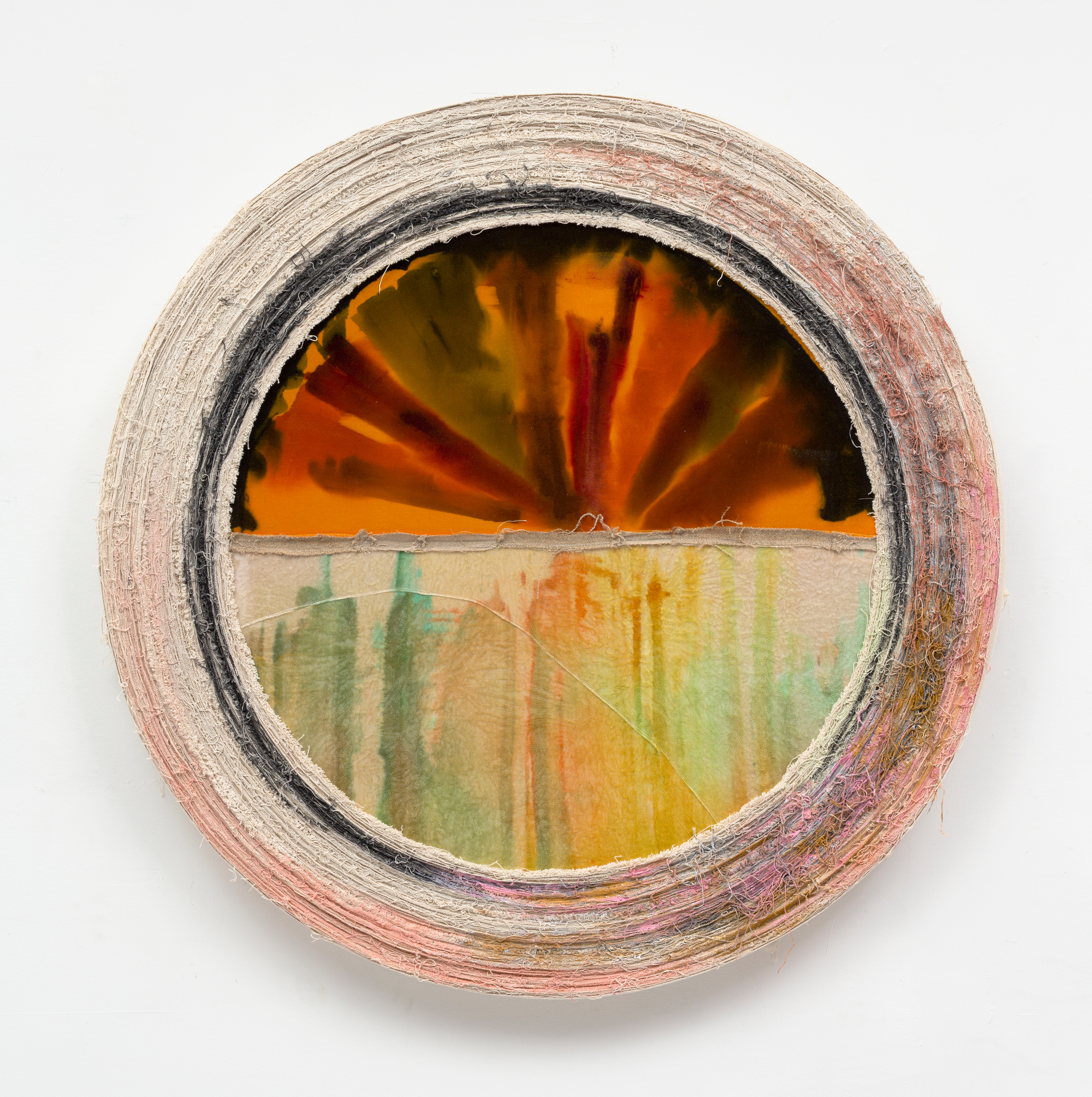 A textile tondo work by Elaine Stocki with sides wrapped in raw canvas and a split seam center with orange velvet pigmented with drippy ink swatches. 
