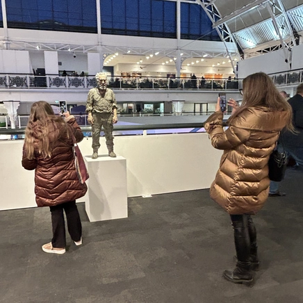 Visitors admiring Standing Man