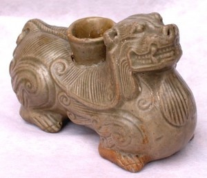 A YUE CELADON GLAZED LION CANDLESTICK, Western Jin Dynasty (265 to 420 AD), Six Dynasties (220 to 589 AD)